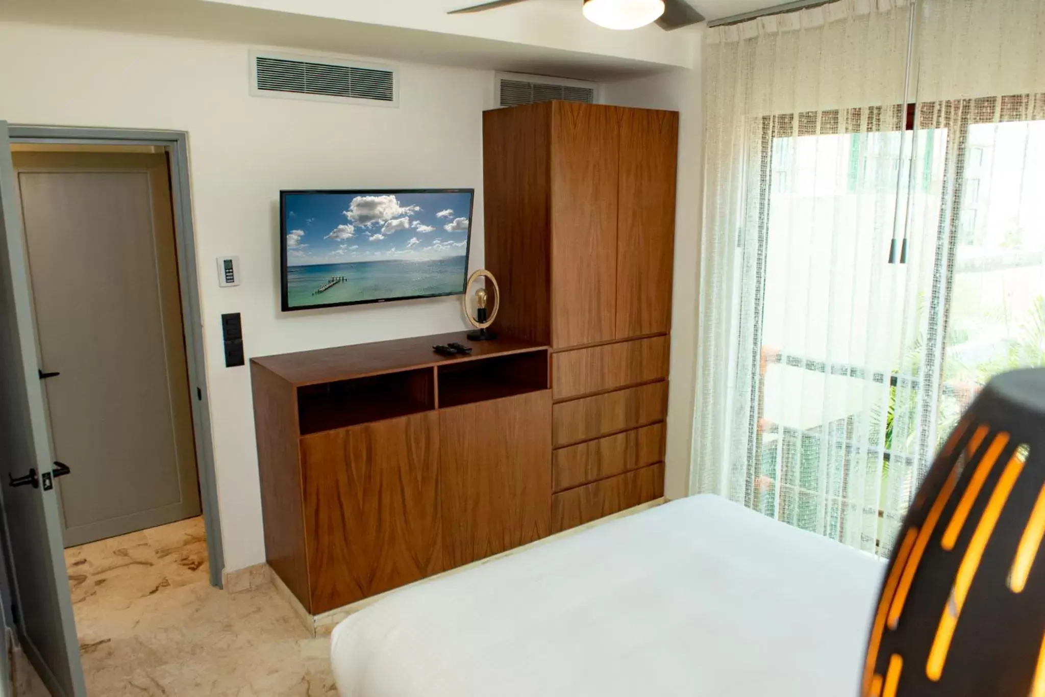 TV and multimedia, TV/Entertainment Center in Maya Villa Condo Hotel and Beachclub