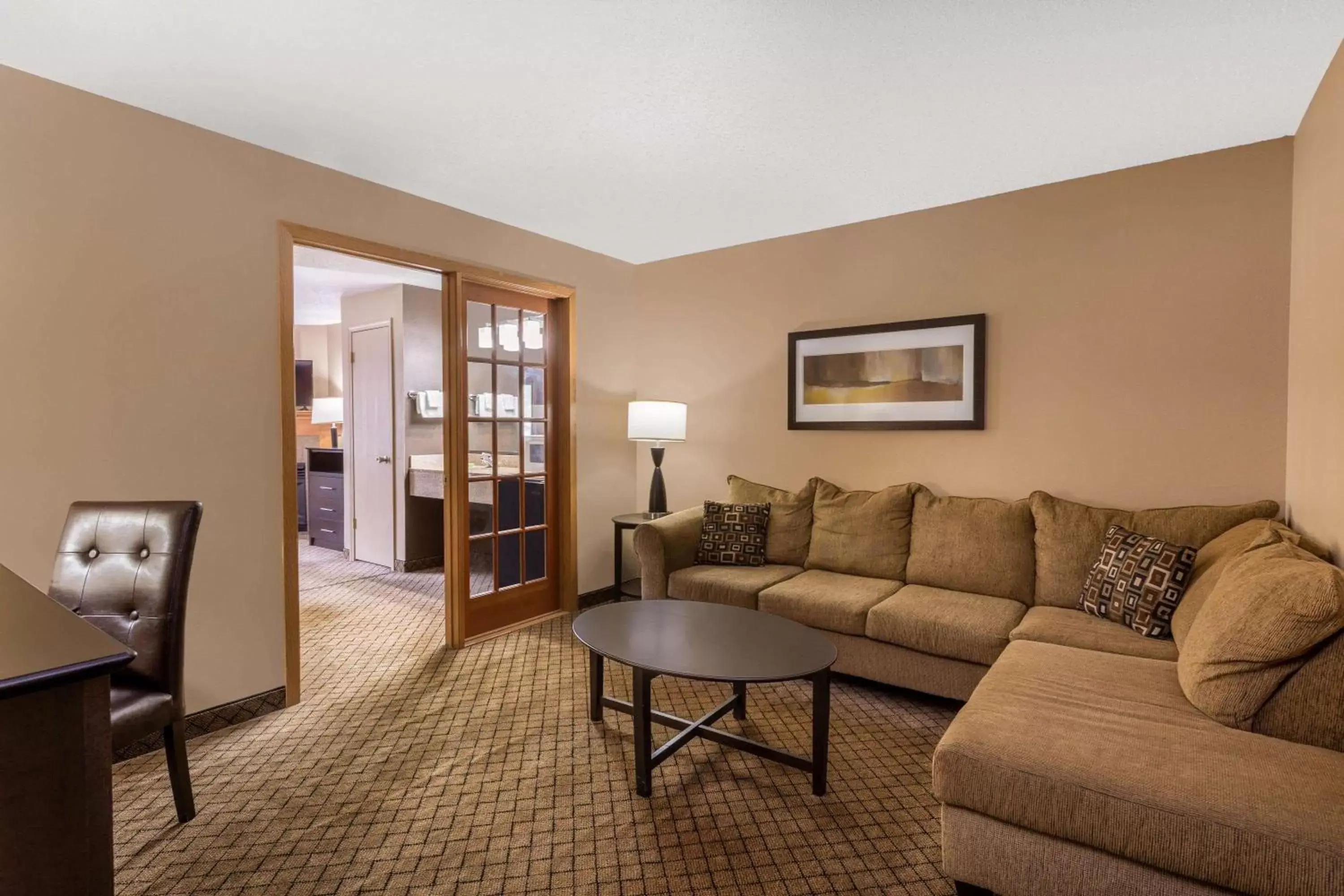 Photo of the whole room, Seating Area in AmericInn by Wyndham Hartford WI