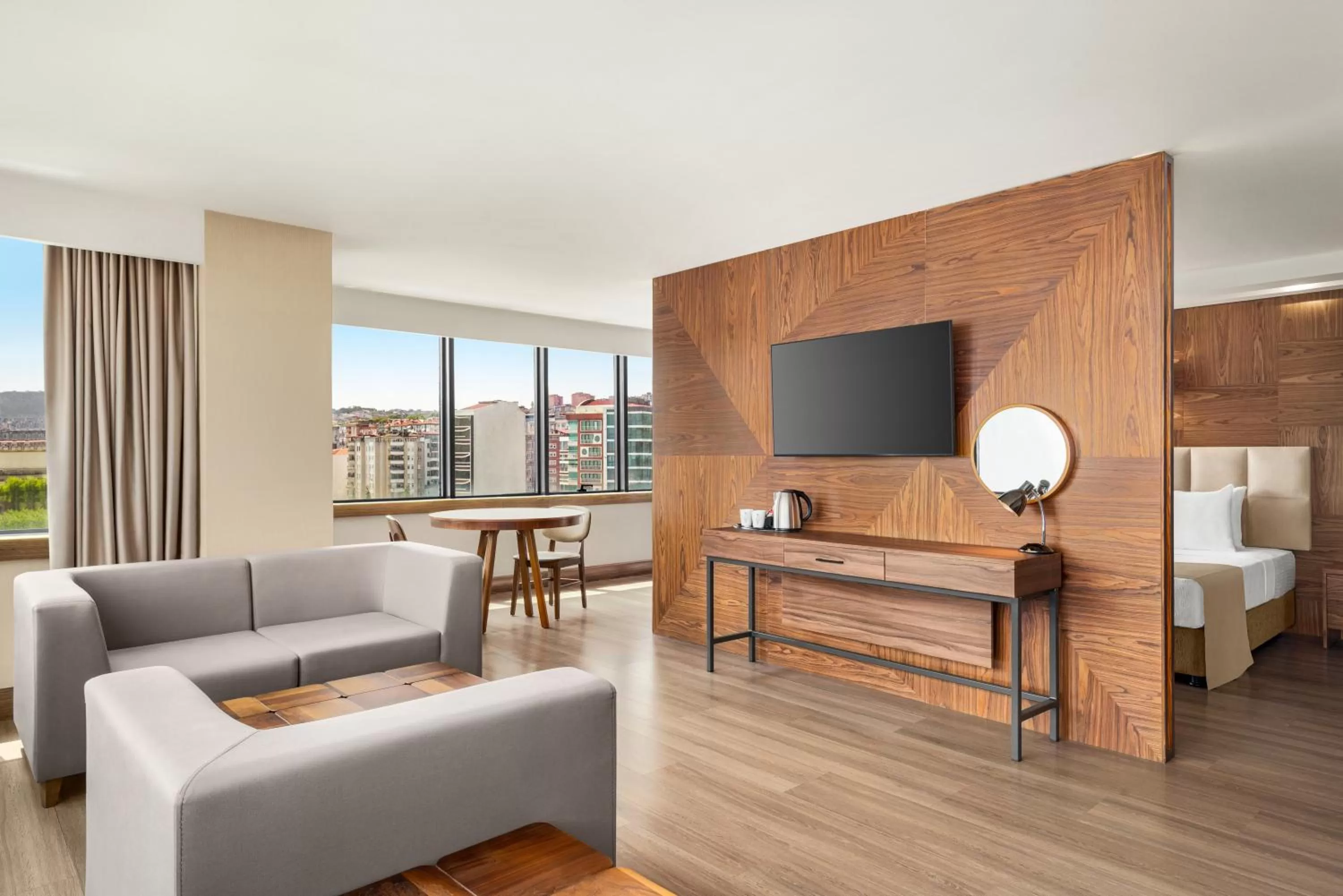 Seating area, Bed in Ramada Plaza by Wyndham Samsun