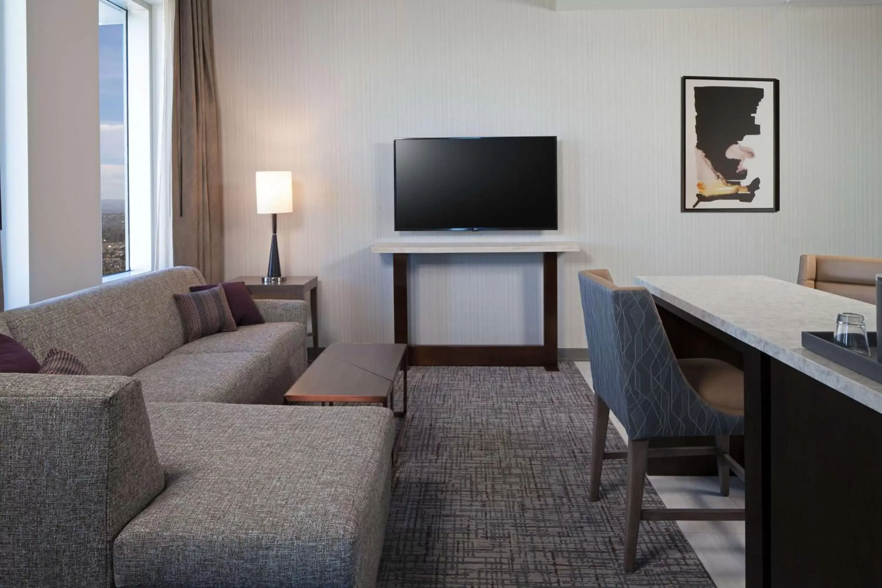 Living room, TV/Entertainment Center in H Hotel Los Angeles, Curio Collection By Hilton