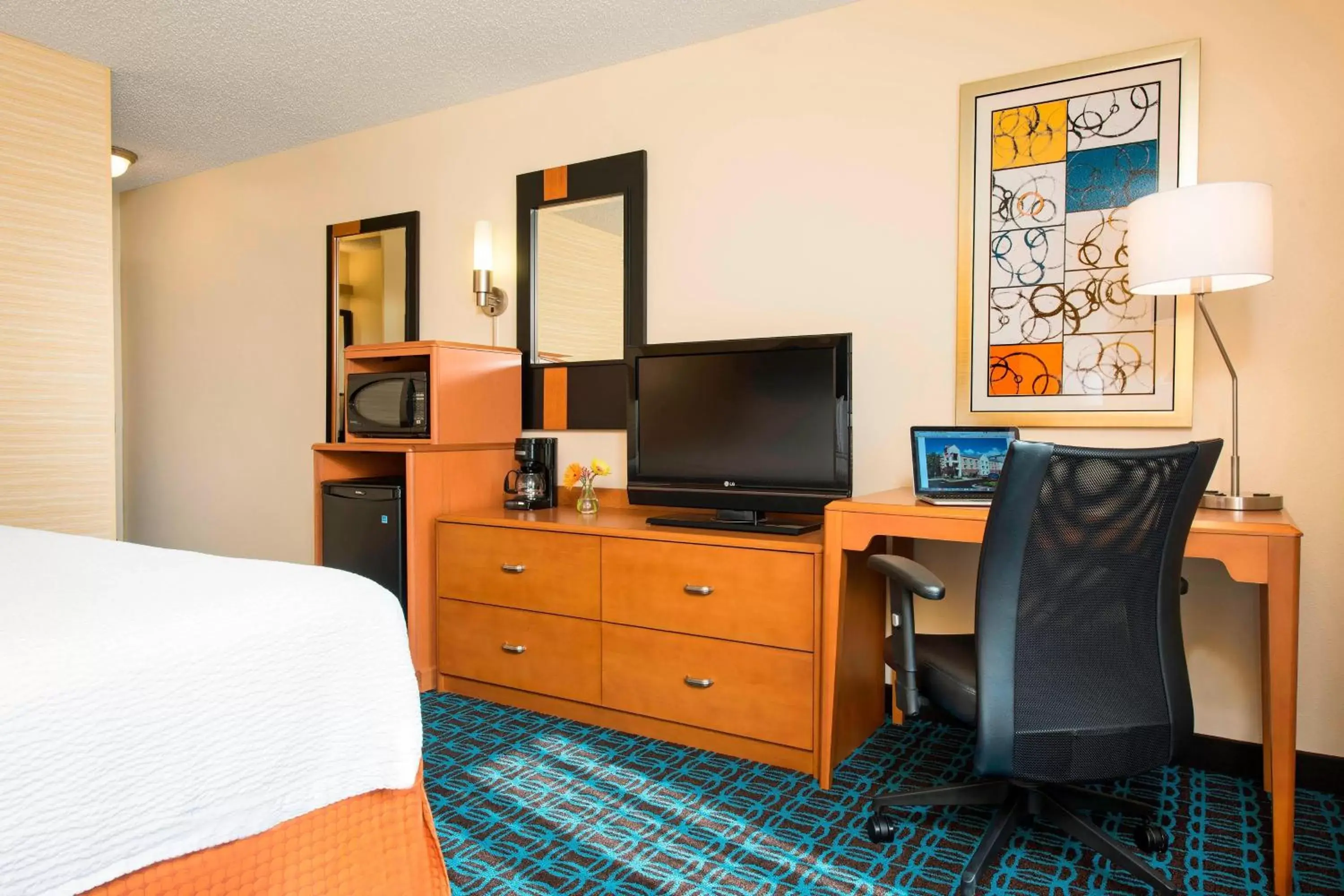 Photo of the whole room, TV/Entertainment Center in Fairfield Inn & Suites by Marriott Bloomington