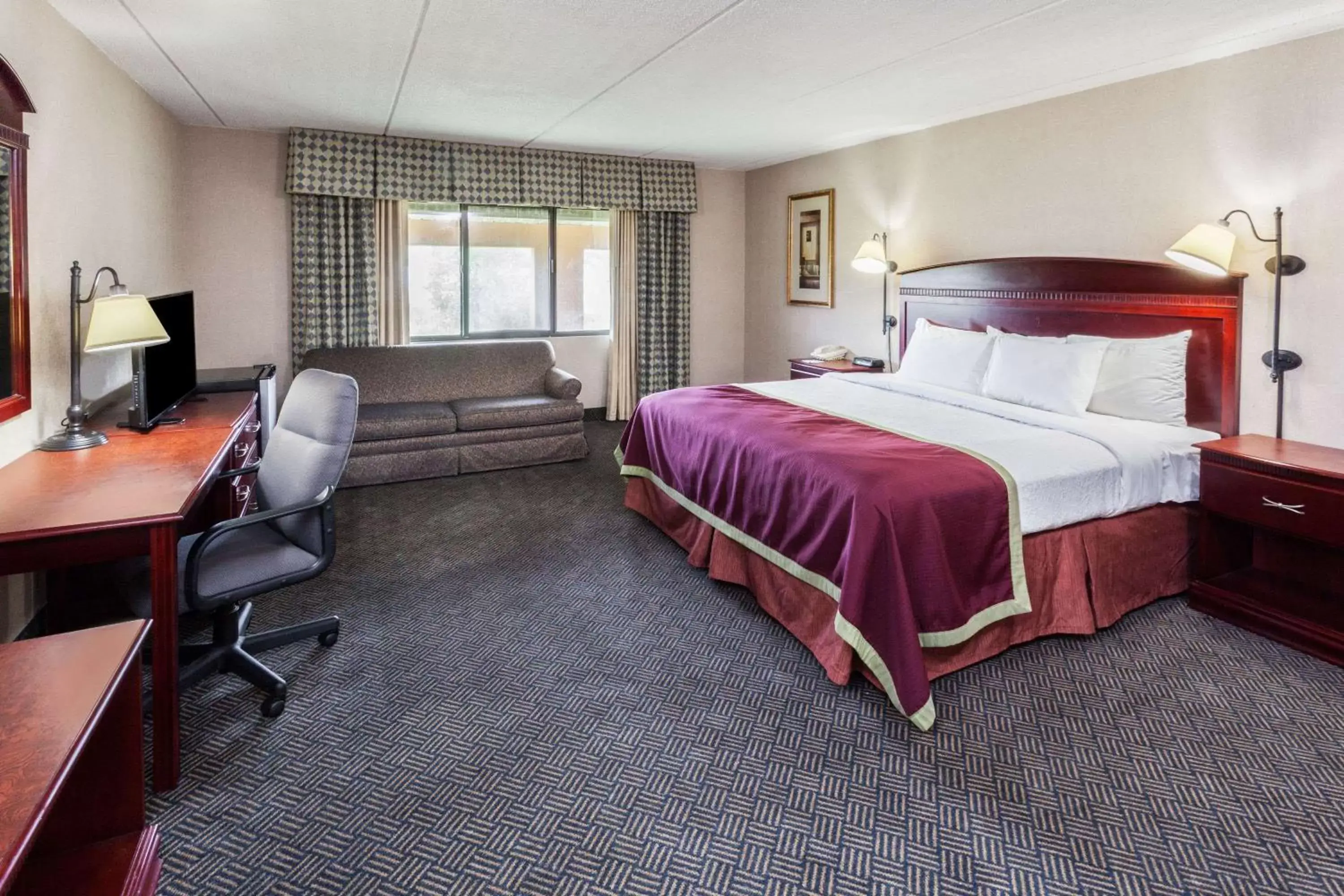 Photo of the whole room, Bed in Baymont by Wyndham Michigan City
