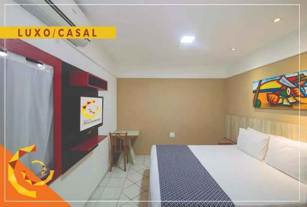Bed in Netuanah Praia Hotel