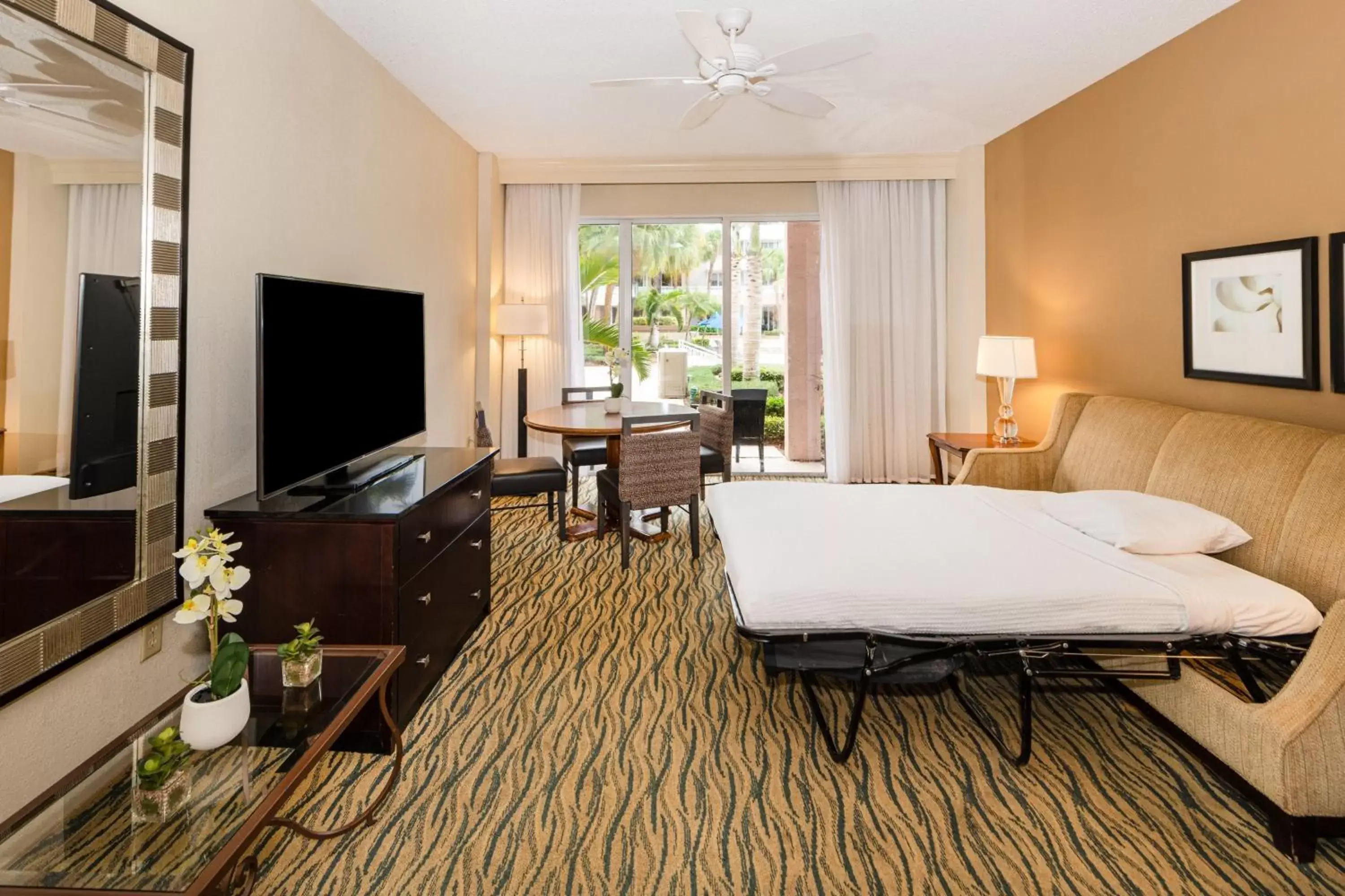 Bedroom, TV/Entertainment Center in Marriott Hutchinson Island Beach Resort, Golf & Marina