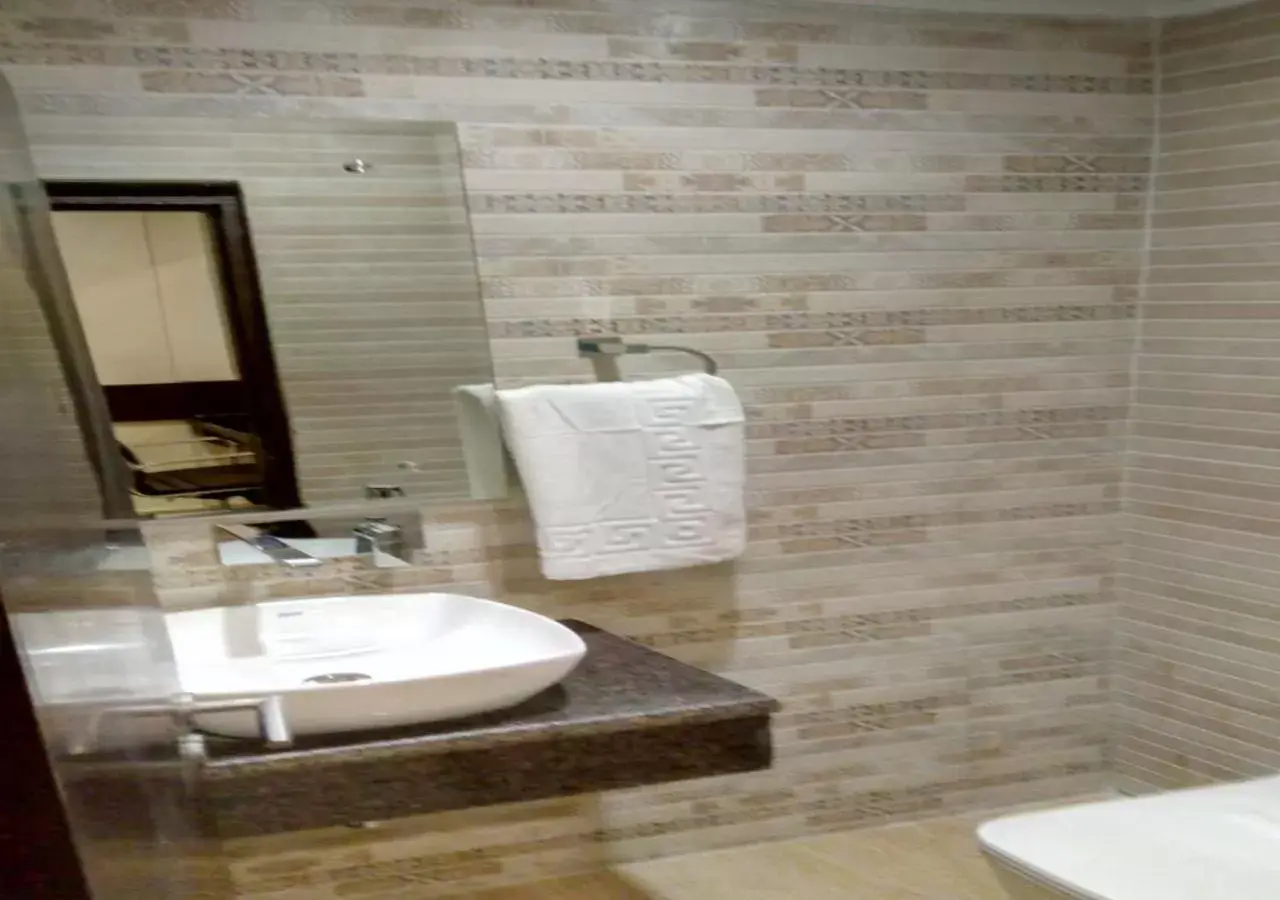 Bathroom in Clarks Inn Suites Katra