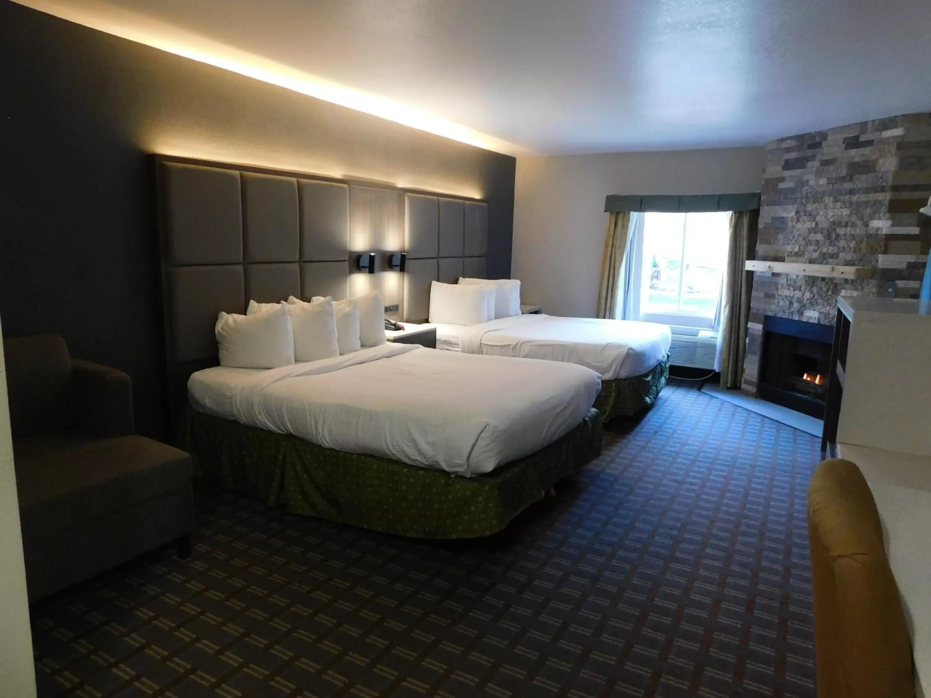 Deluxe Room, 2 Queen Beds, Non Smoking, Fireplace in Days Inn & Suites by Wyndham Downtown Gatlinburg Parkway Deluxe Room, 2 Queen Beds, Non Smoking, Fireplace in Days Inn & Suites by Wyndham Downtown Gatlinburg Parkway