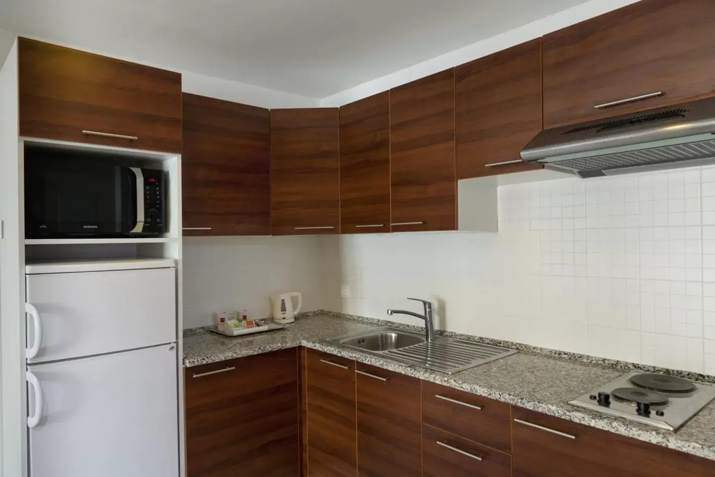 Kitchen/Kitchenette in Le Corail Suites Hotel