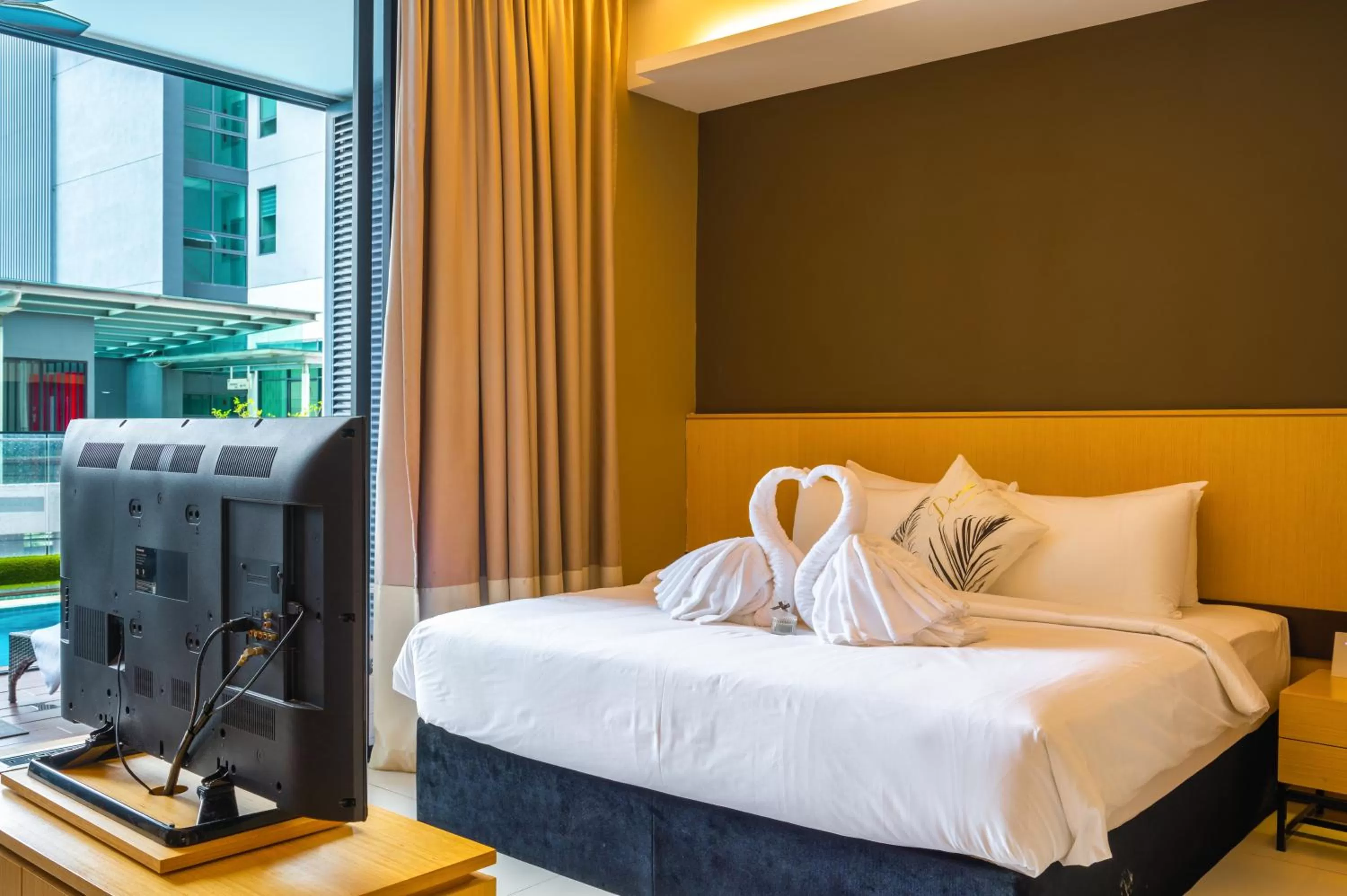 Bed in Greystone 99 Suites