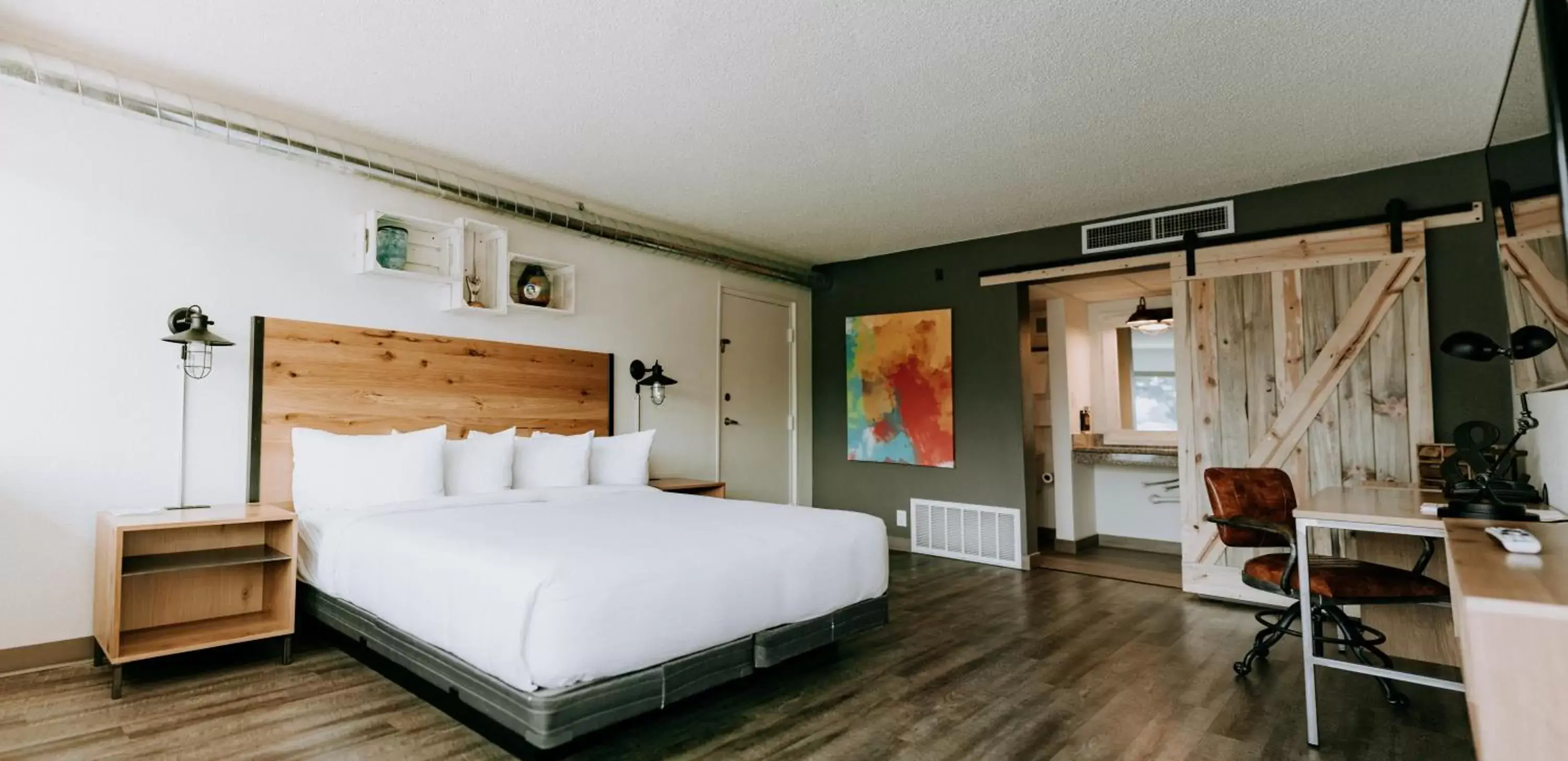 Bedroom in SCP Colorado Springs Hotel