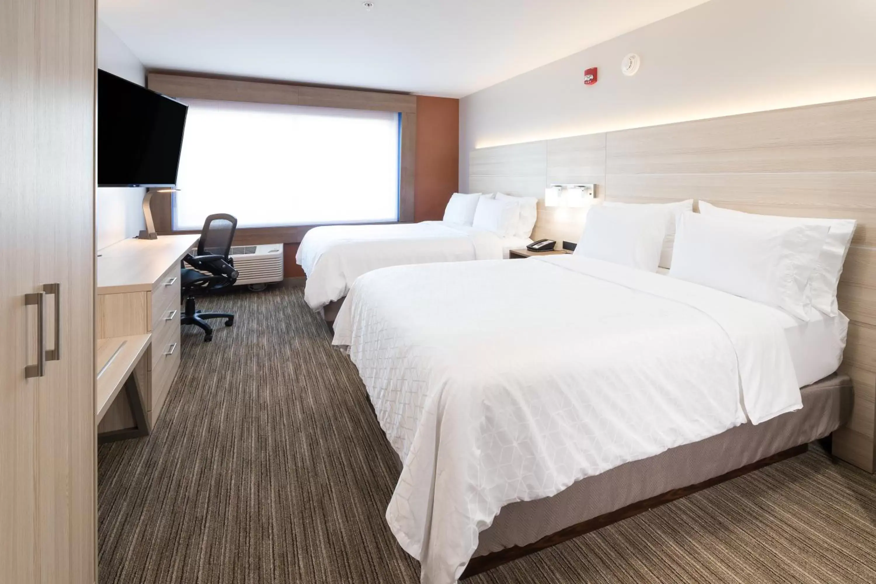 Bed in Holiday Inn Express & Suites - Michigan City, an IHG Hotel