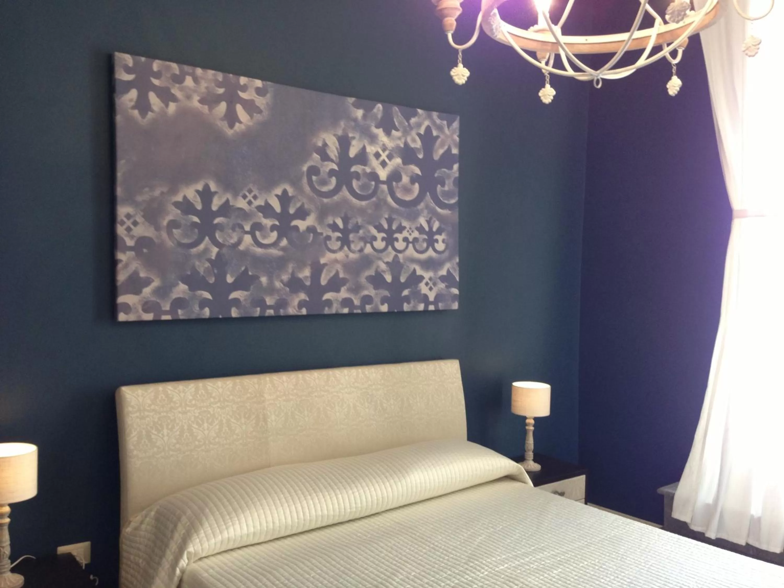 Decorative detail, Bed in Albergo Diffuso Dimora Rossi B&B