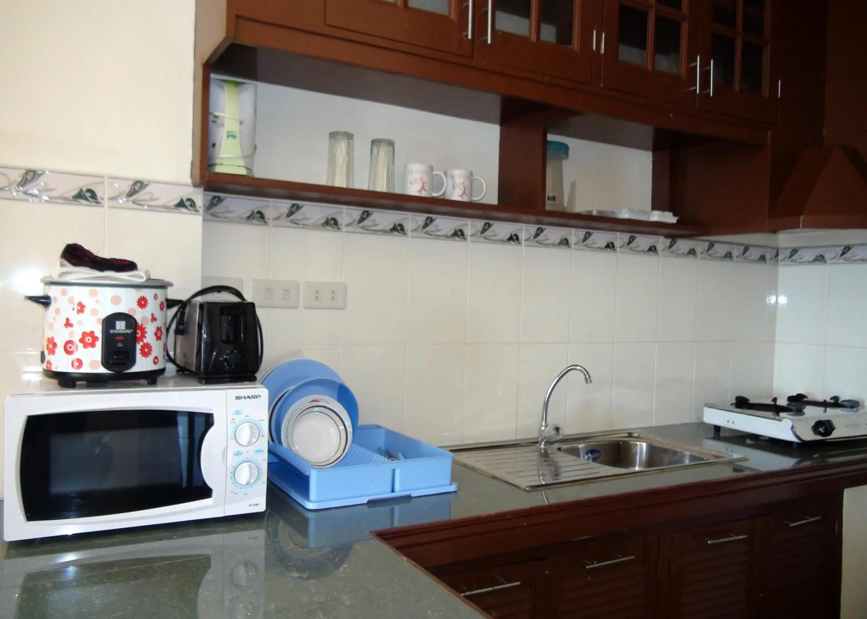 Kitchen/Kitchenette in Squares Beachside Apartments