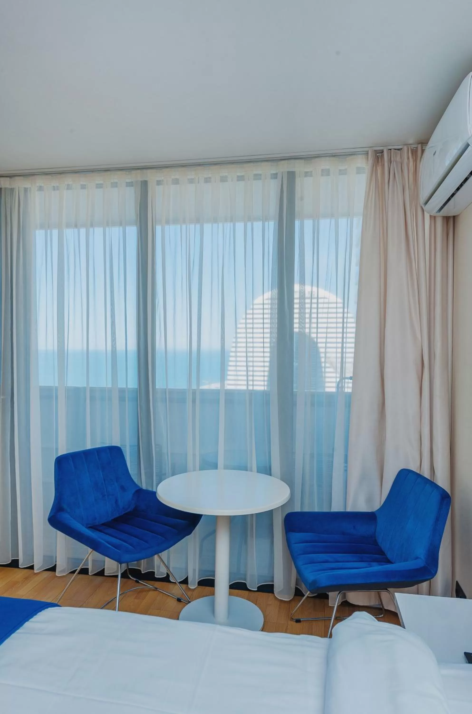 Bed, Seating Area in Orbi City Luxury Suite