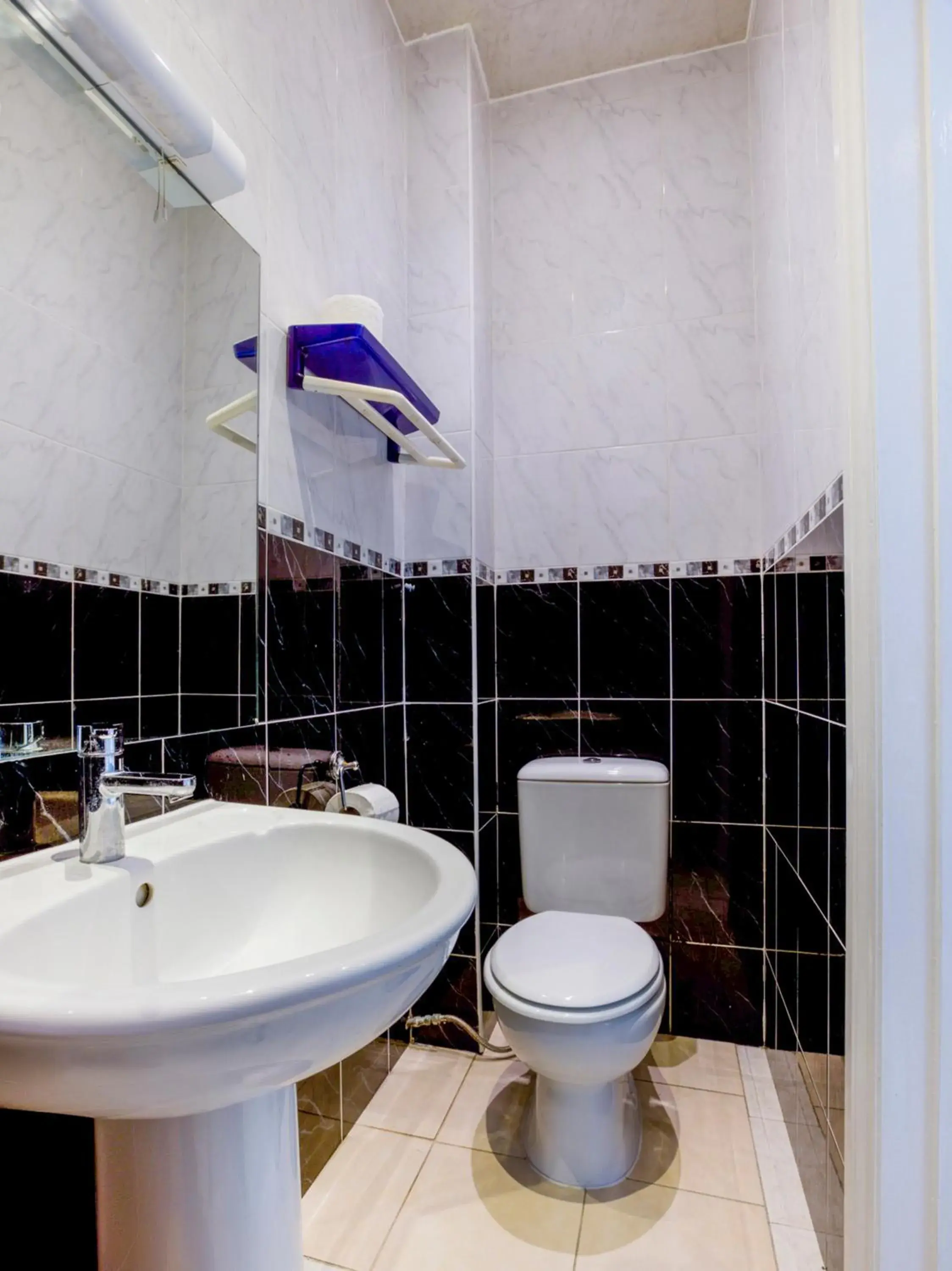 Bathroom in OYO Sino Hotel