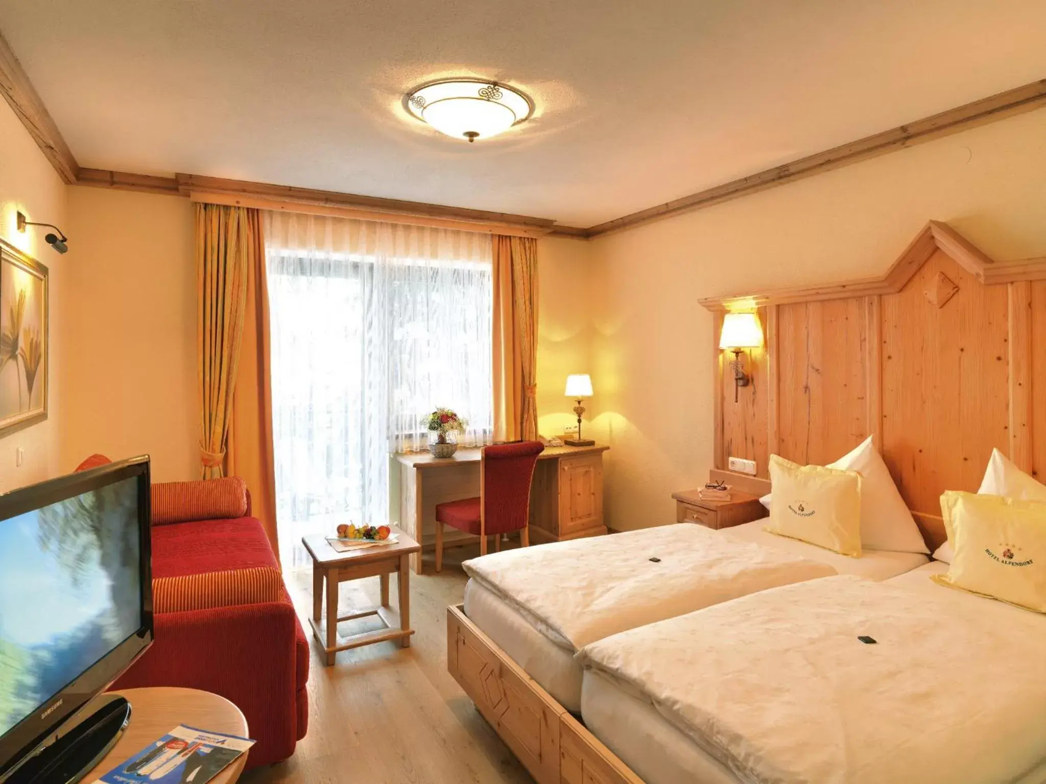 Photo of the whole room, Bed in Aktivhotel Alpendorf