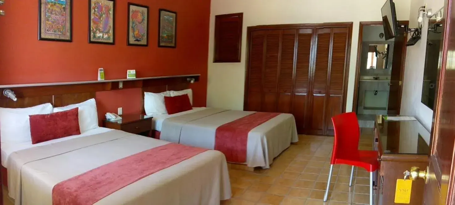 Bed in Villas del Sol Hotel & Bungalows