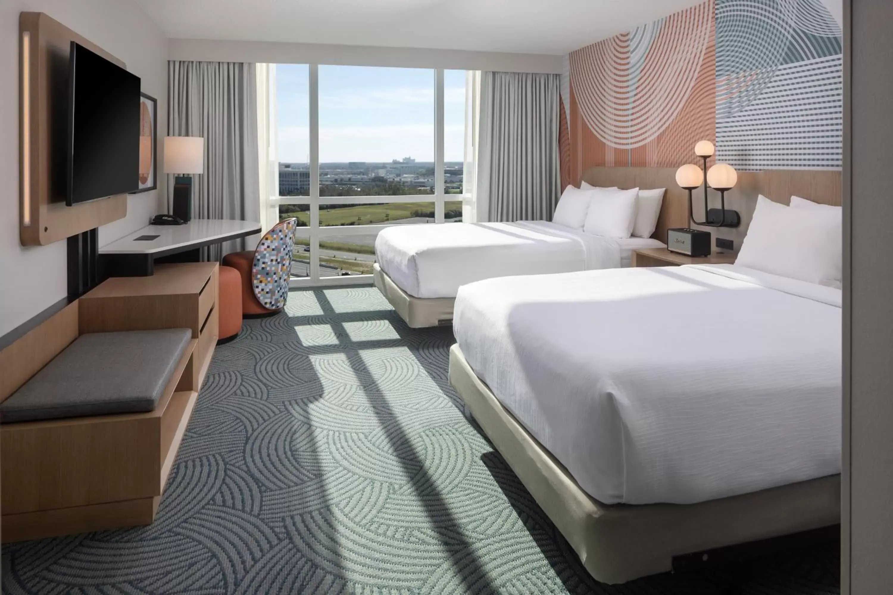Deluxe Queen Room with Two Queen Beds and Skyline View in Hotel Kinetic Orlando Universal Blvd