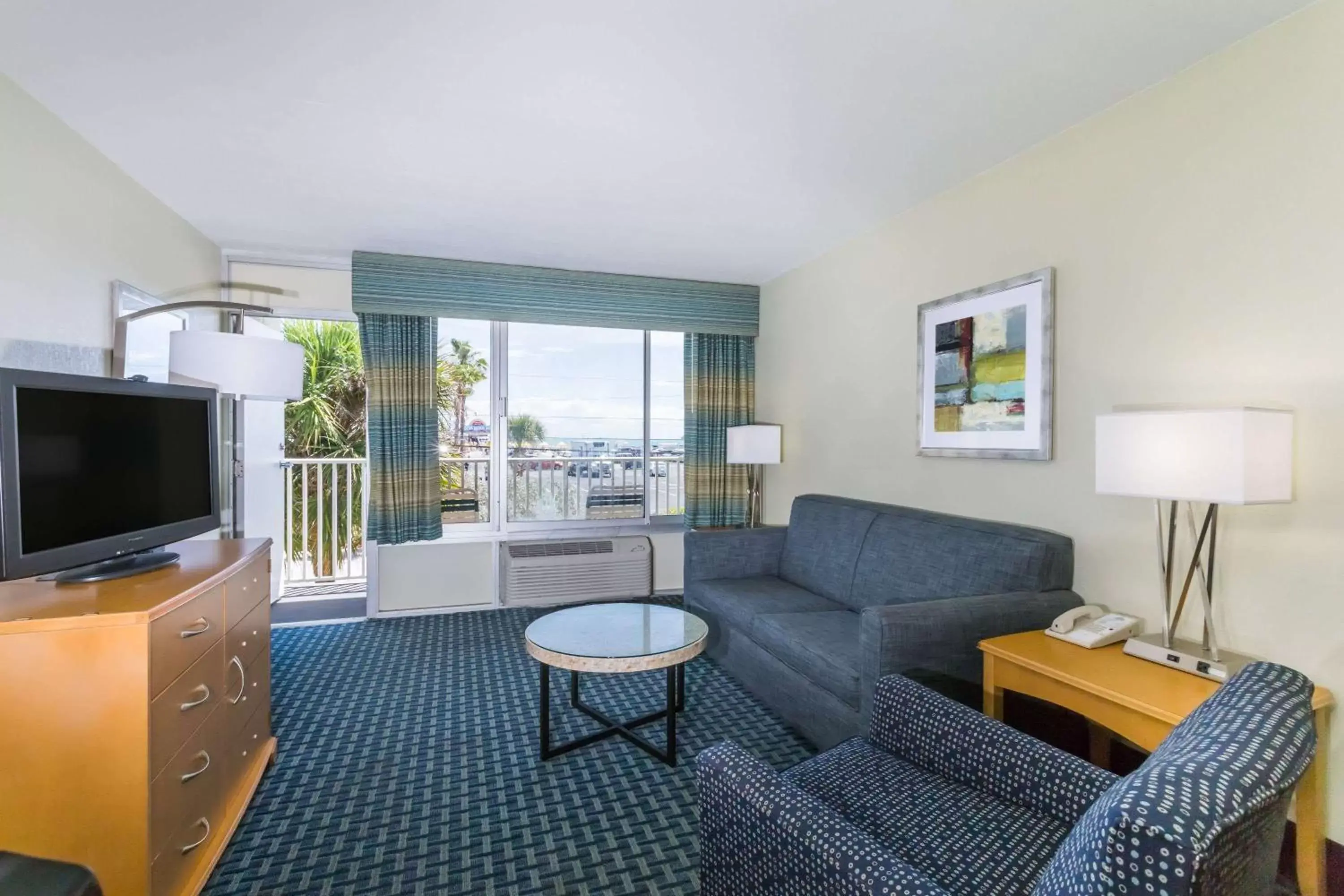 Photo of the whole room, Seating Area in Days Inn by Wyndham Cocoa Beach Port Canaveral