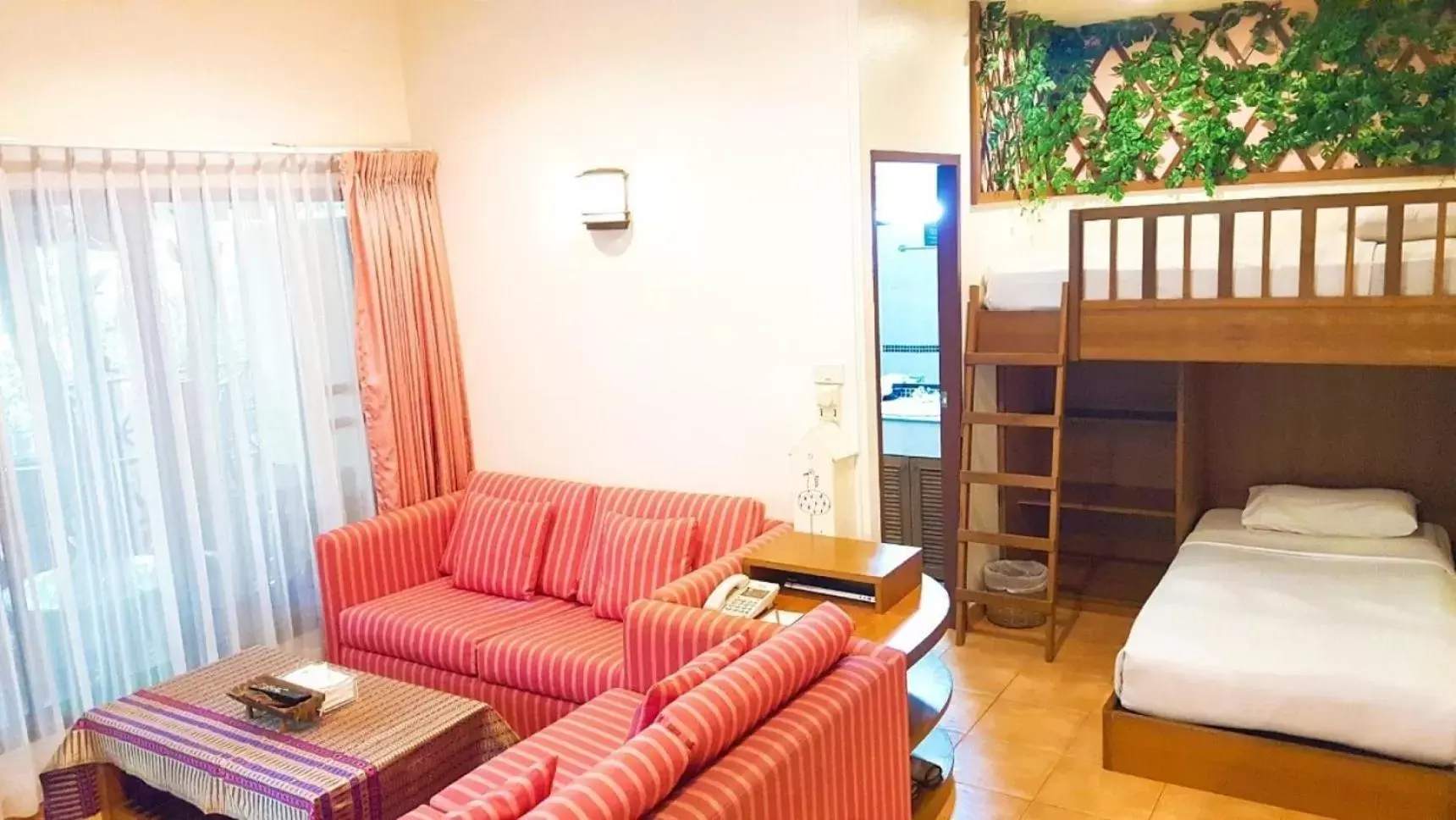 Seating area, Bed in Birds and Bees Resort Seating area, Bed in Birds and Bees Resort