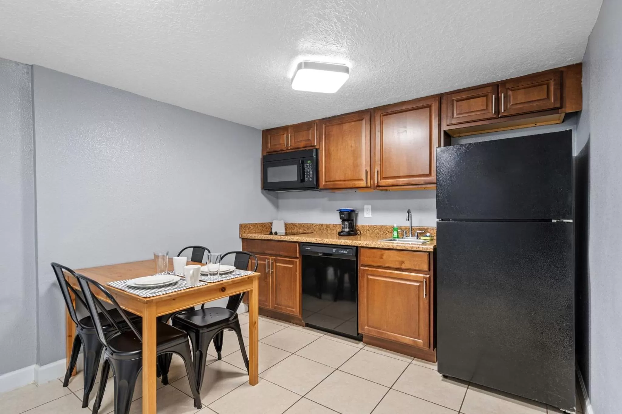 Kitchen or kitchenette in Celebration Suites