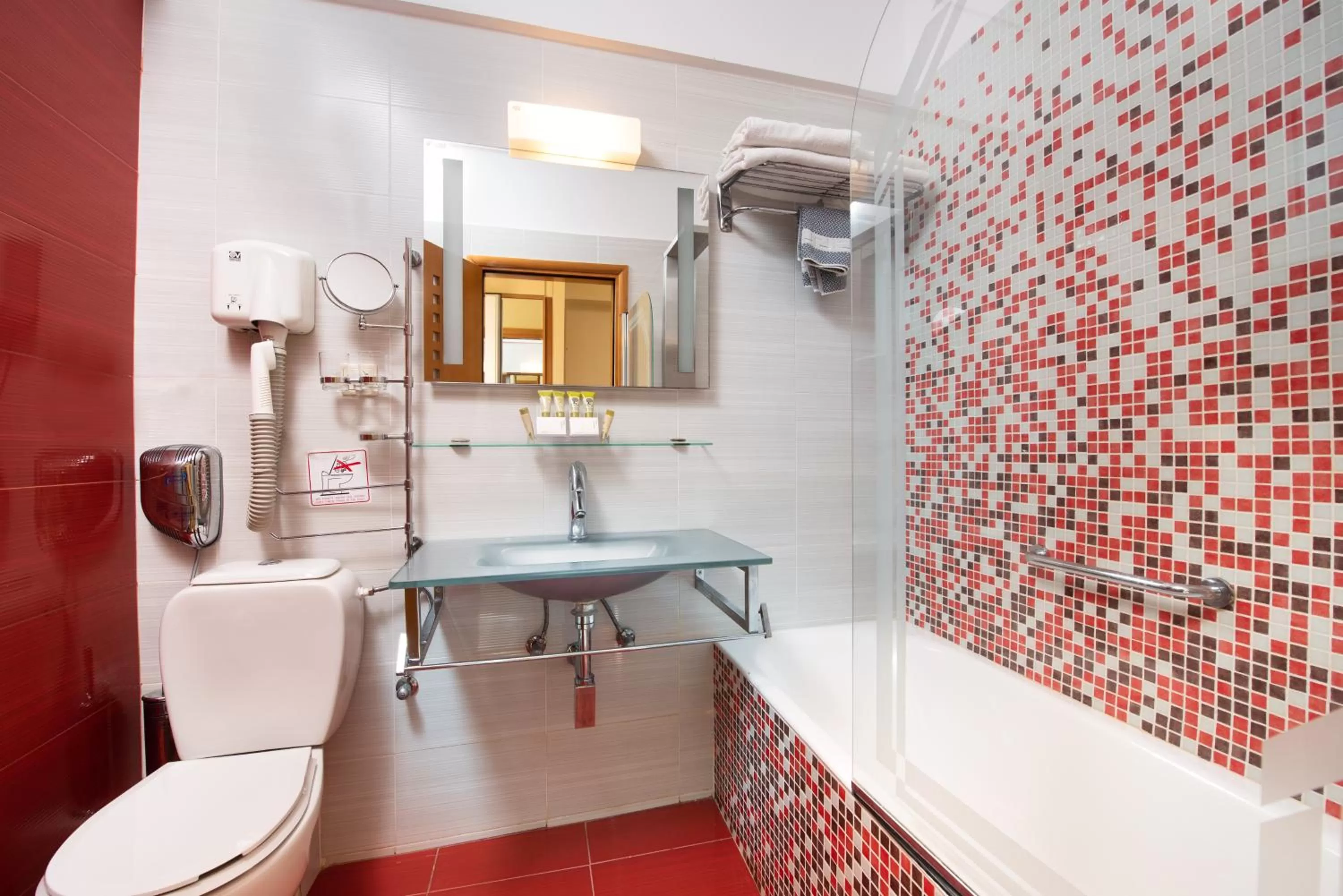 Toilet in Heliotrope Hotels