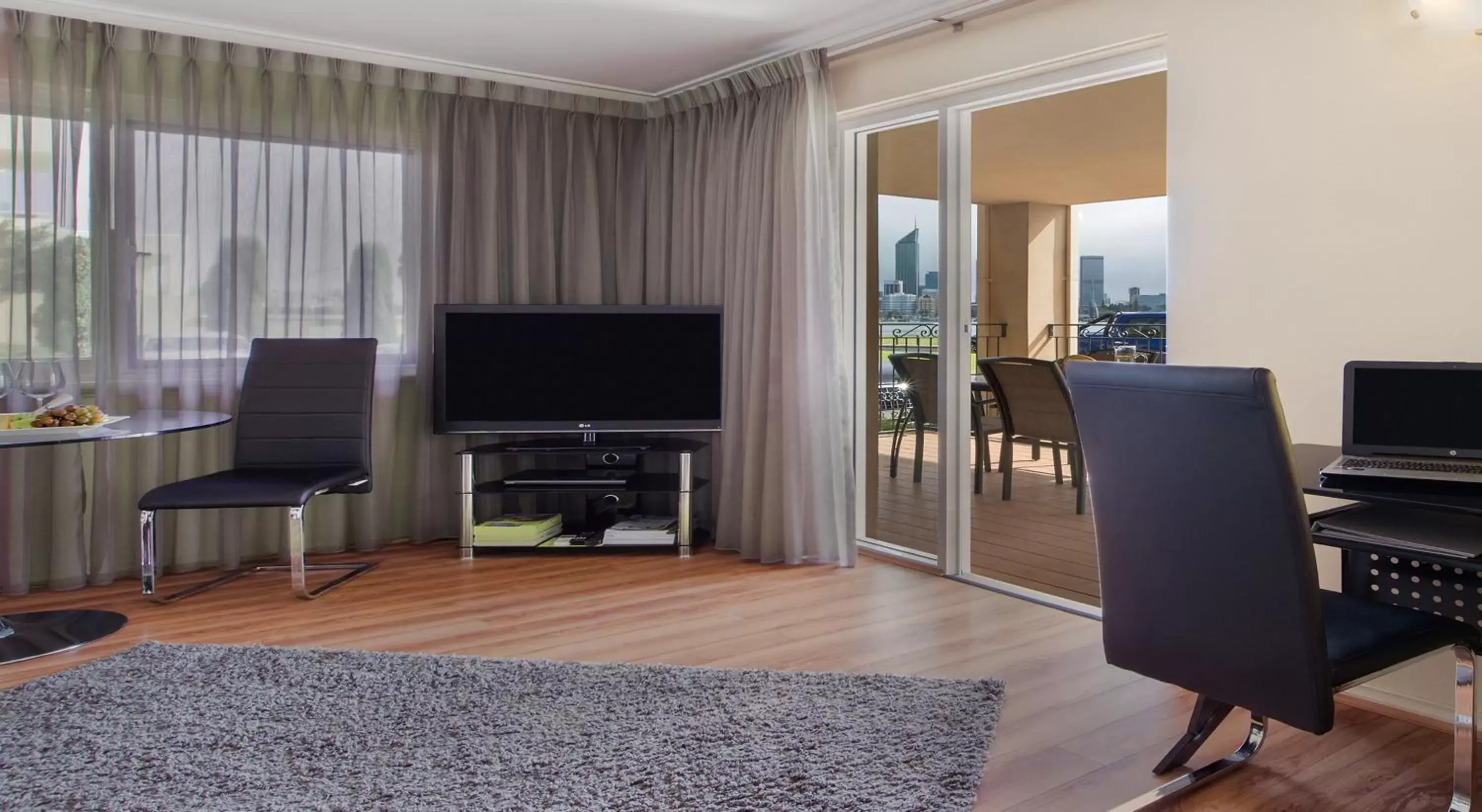 Living room, TV/Entertainment Center in The Peninsula Riverside Serviced Apartments