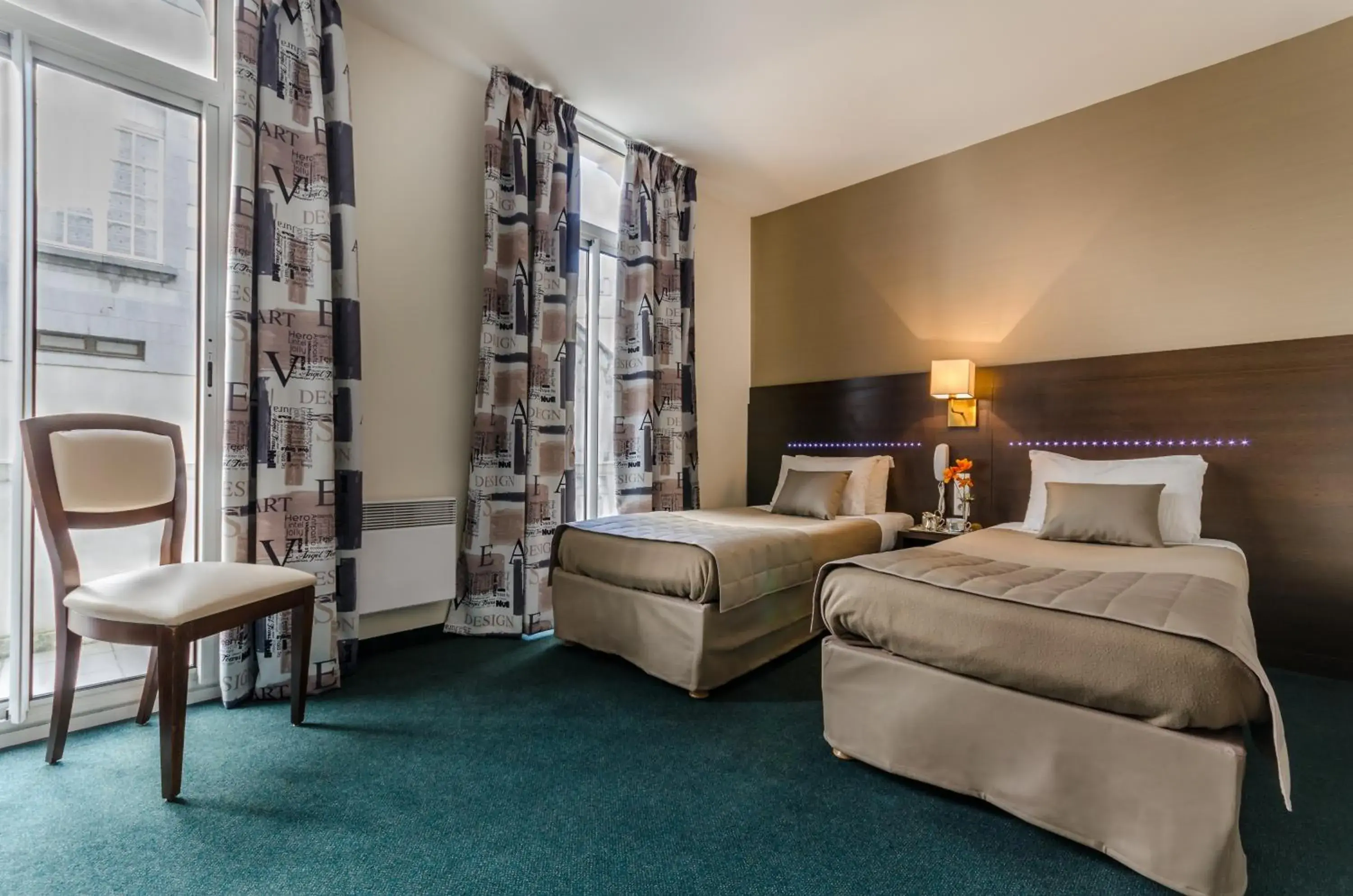 Bedroom in Hôtel Croix des Bretons - Lourdes Pyrénées Bedroom in Hôtel Croix des Bretons - Lourdes Pyrénées