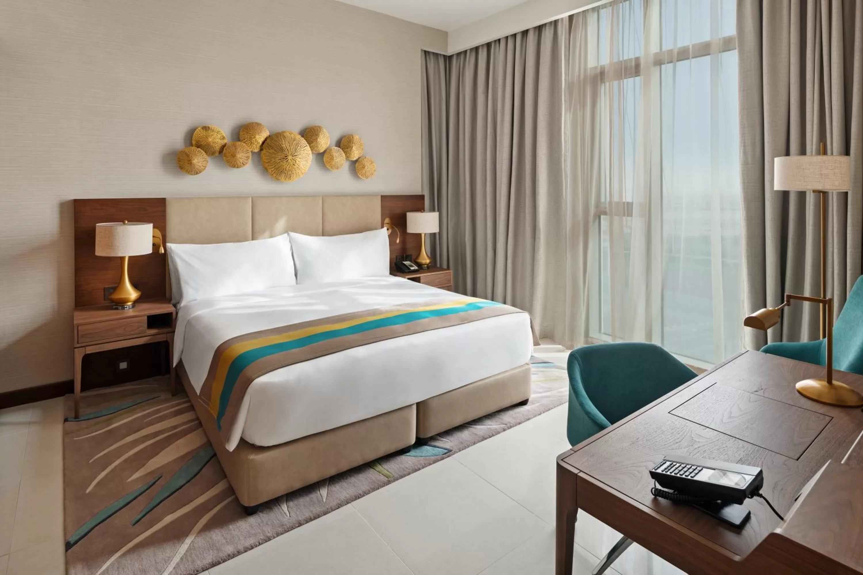 Bed in Holiday Inn Dubai Al-Maktoum Airport by IHG