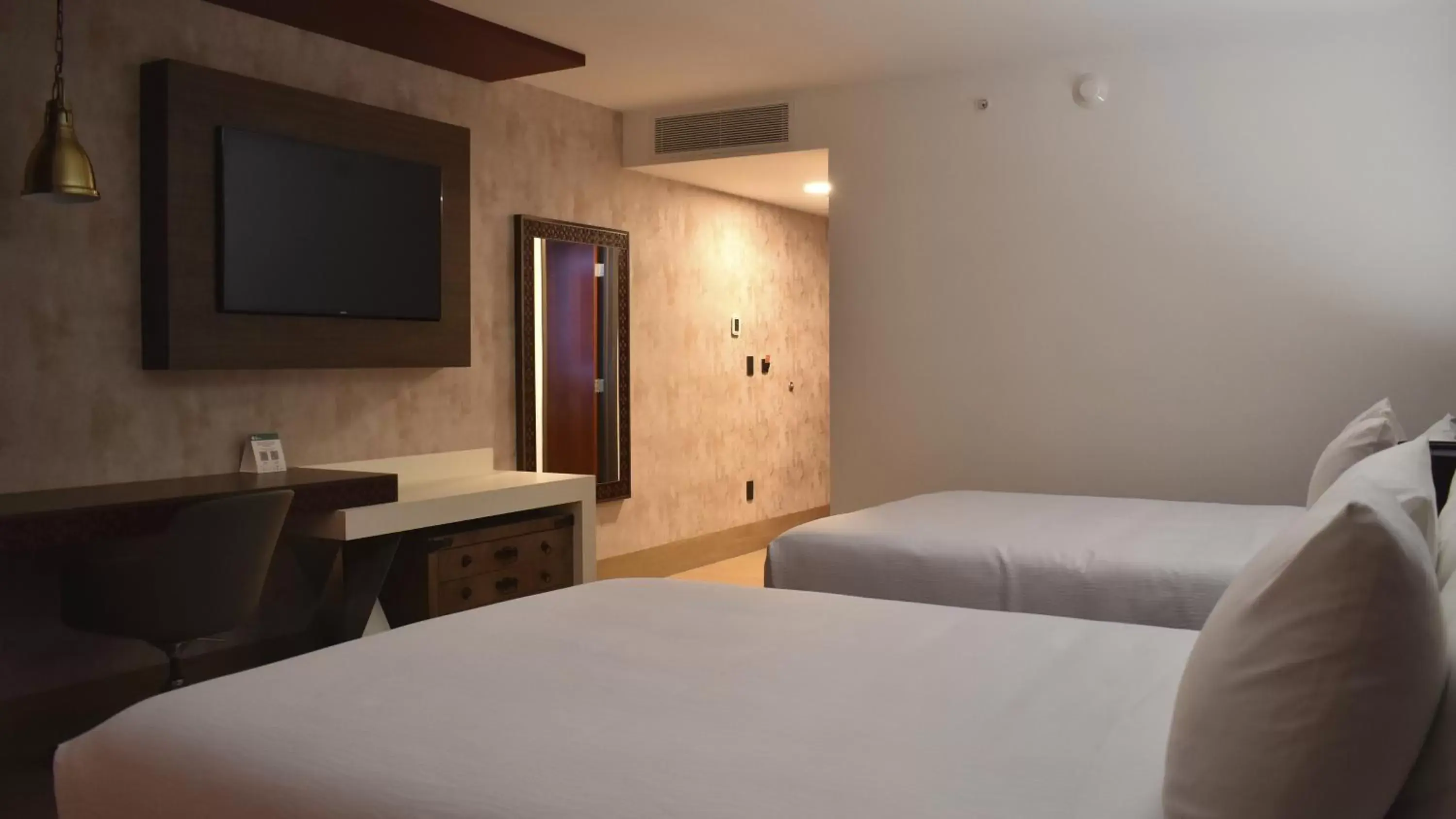 Bed in Hotel Indigo Guanajuato, an IHG Hotel