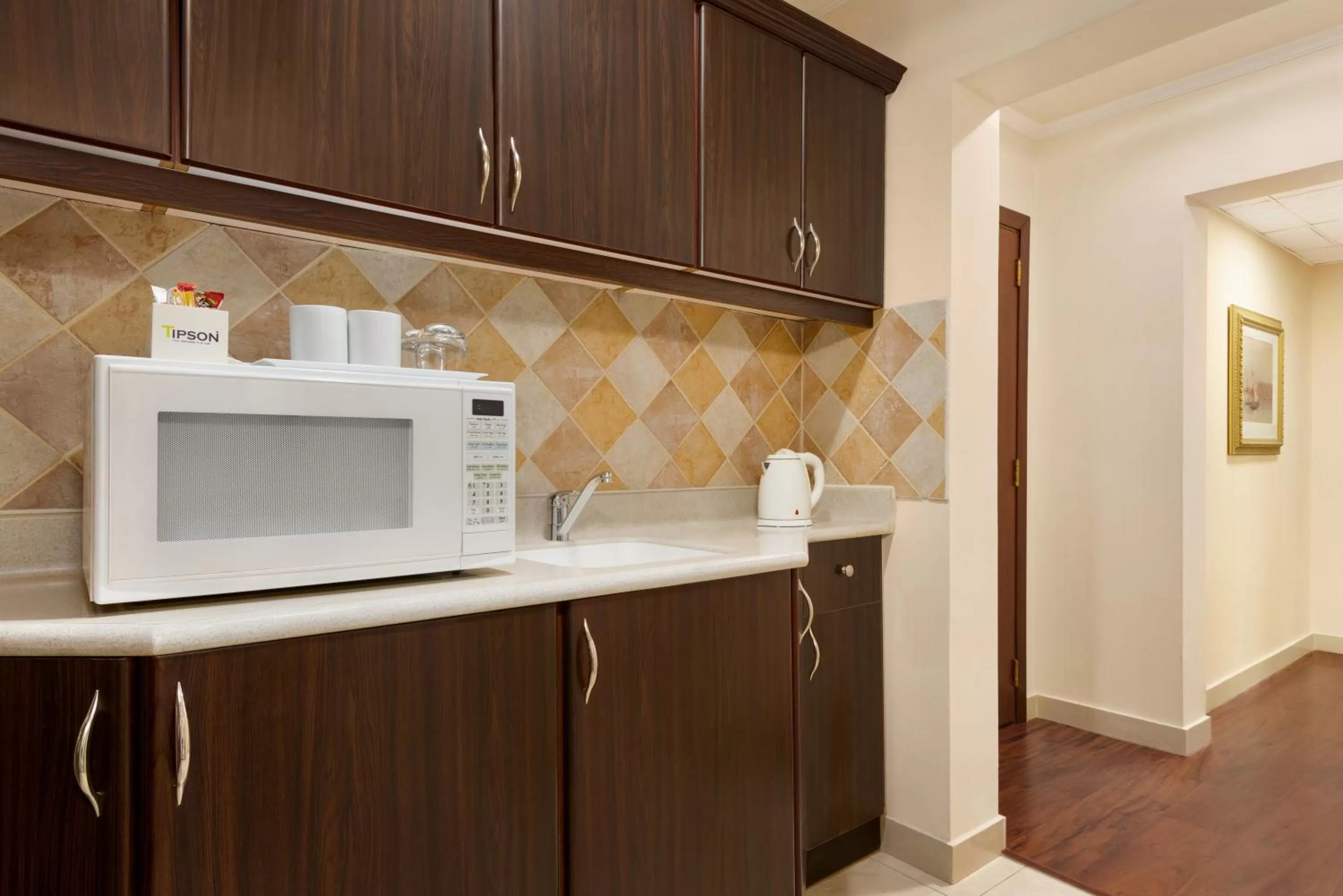 Kitchen or kitchenette in Eastyard Dammam Hotel - Formerly Ramada by Wyndham Dammam