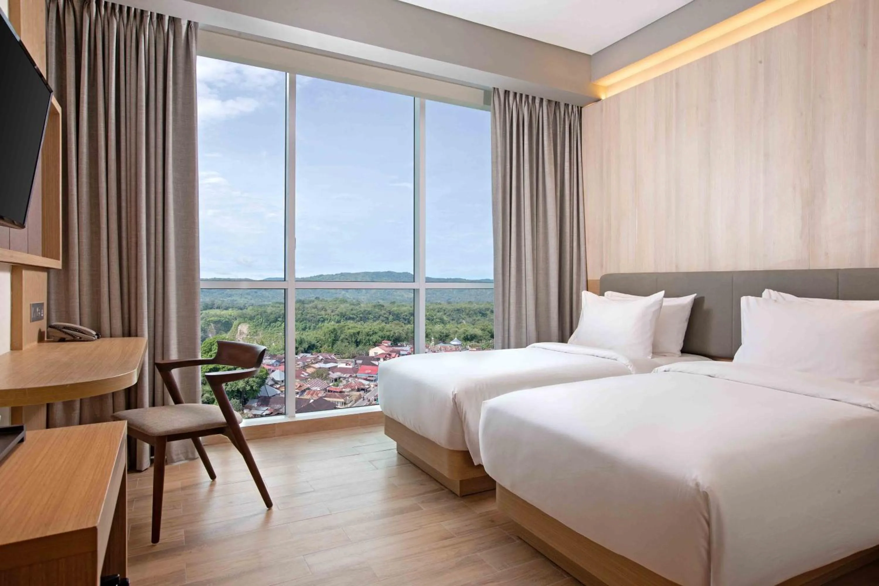 Photo of the whole room, Bed in Hotel Santika Bukittinggi