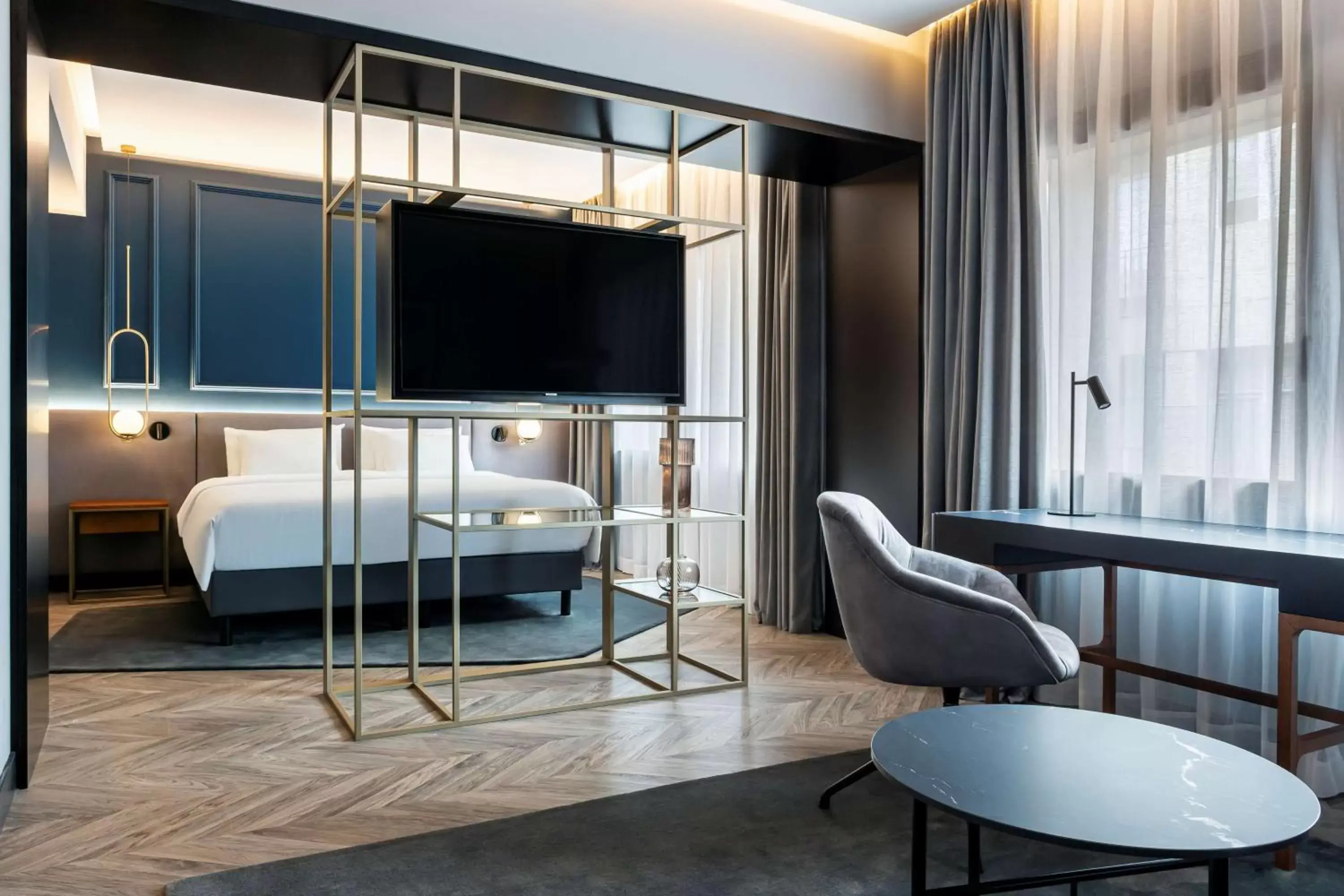 Bed, TV/Entertainment Center in Radisson Collection Bilbao