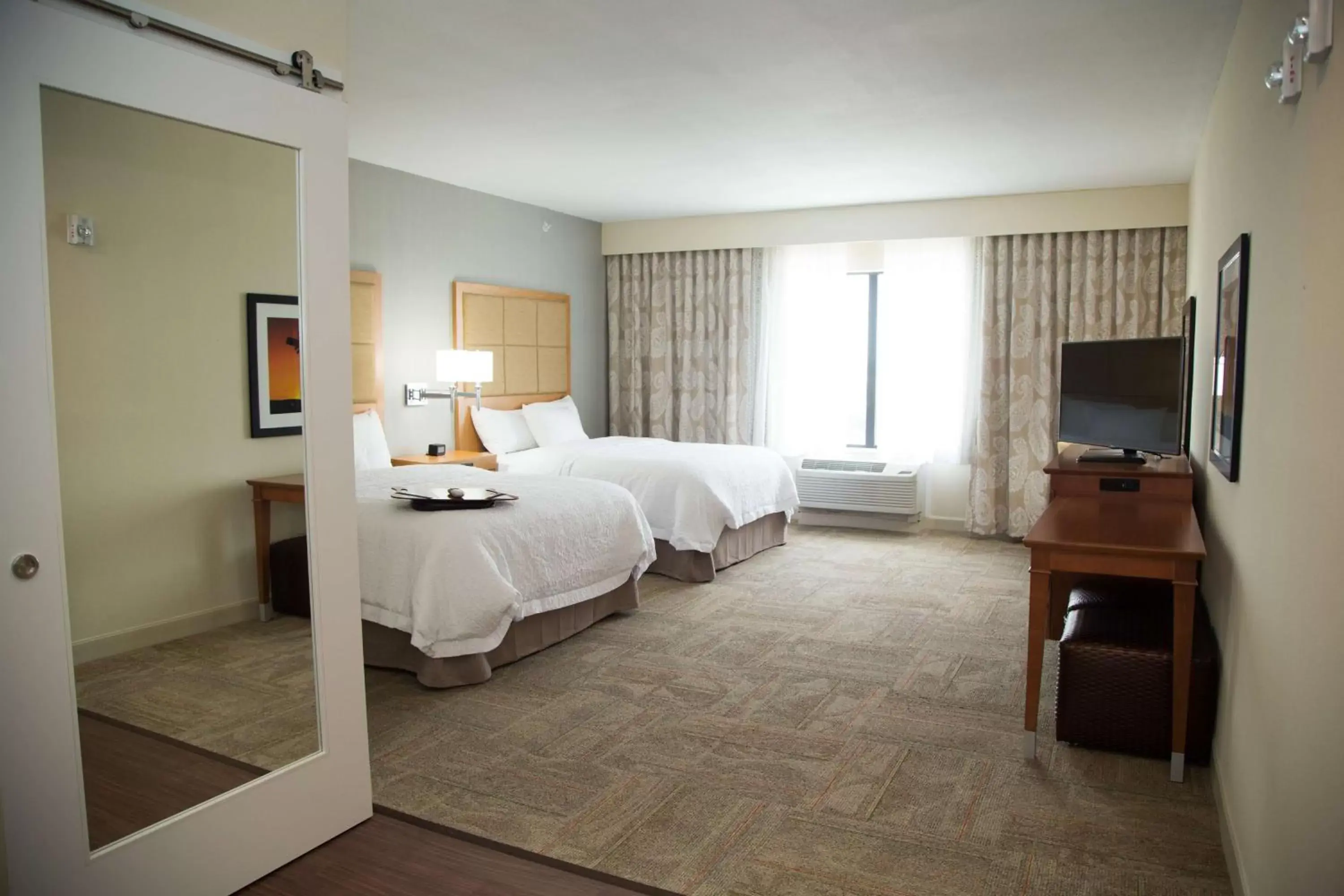 Bed in Hampton Inn and Suites by Hilton McKinney