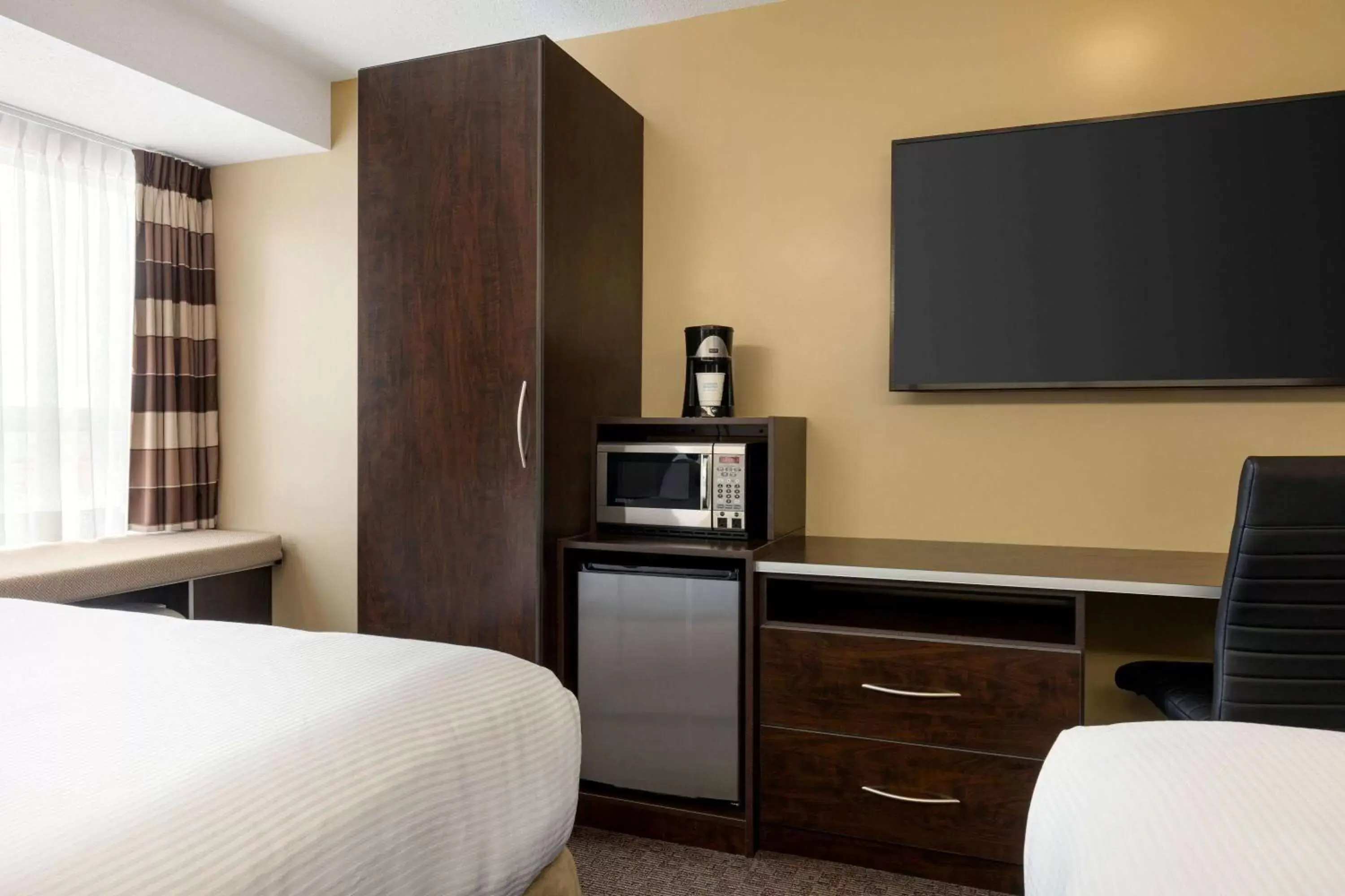 Photo of the whole room, TV/Entertainment Center in Microtel Inn & Suites by Wyndham Estevan