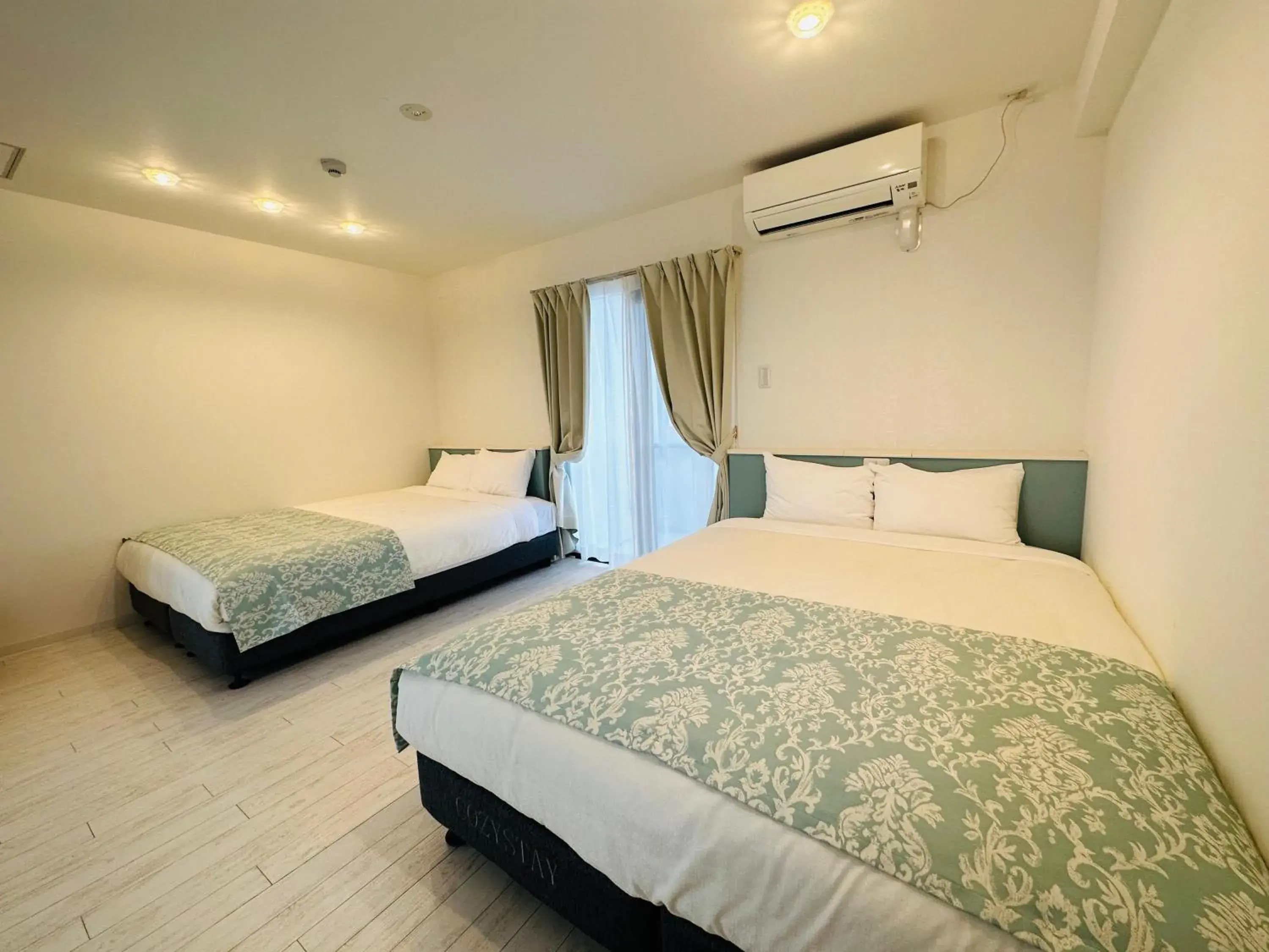 Bed in Cozy Stay in Naha