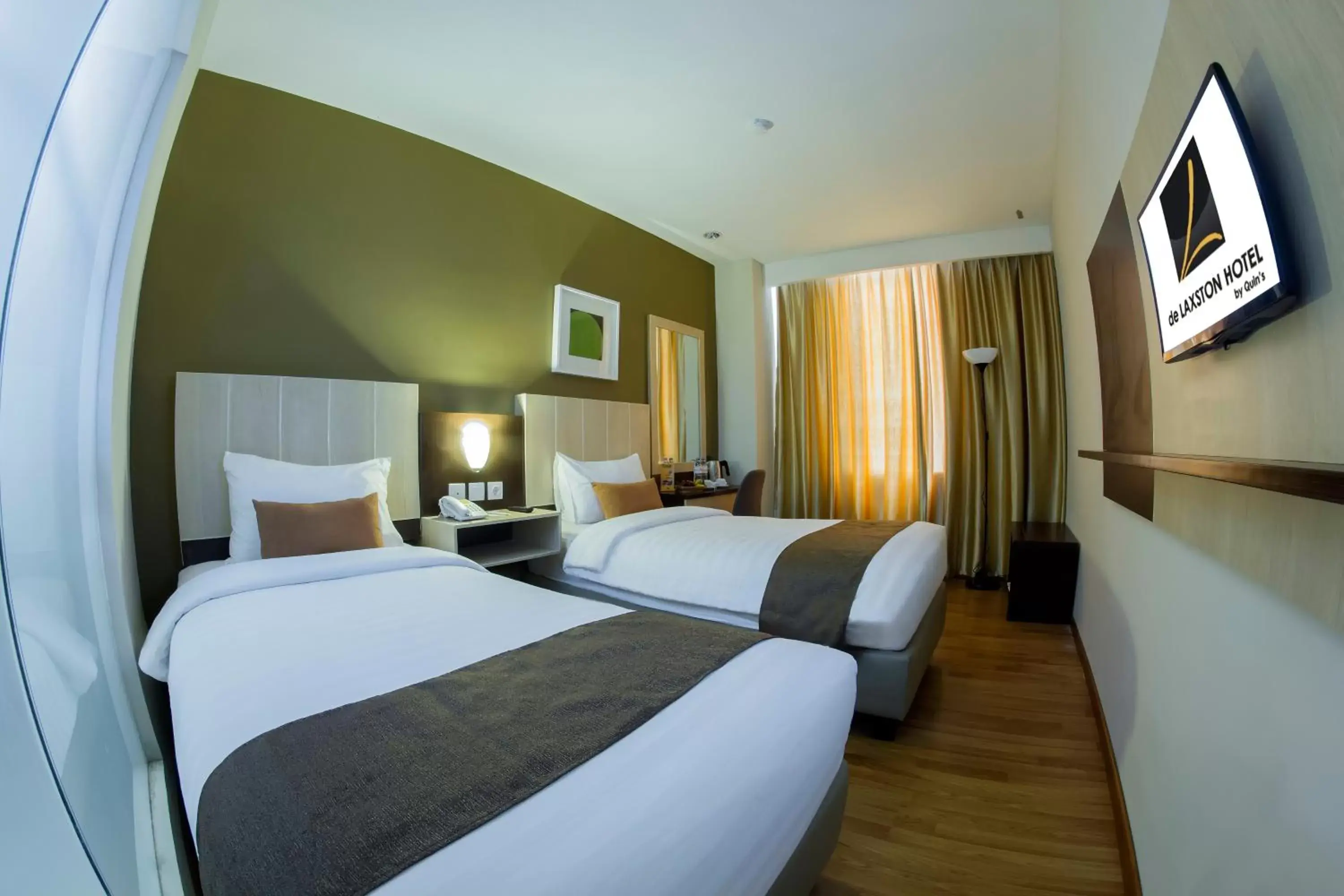 Bedroom, Bed in de Laxston Hotel Jogja by AZANA