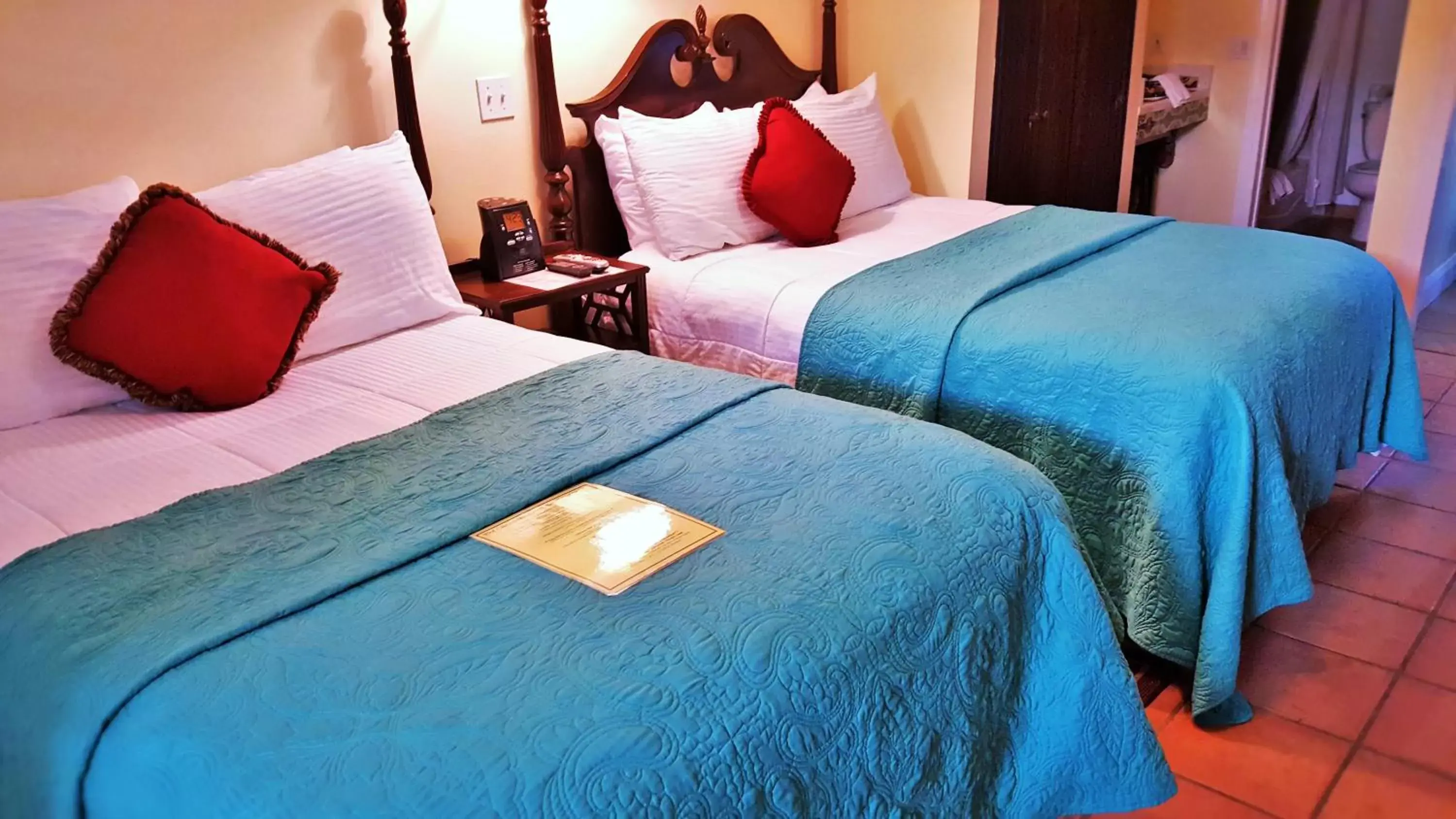 Bedroom, Bed in The Caribbean Court Boutique Hotel