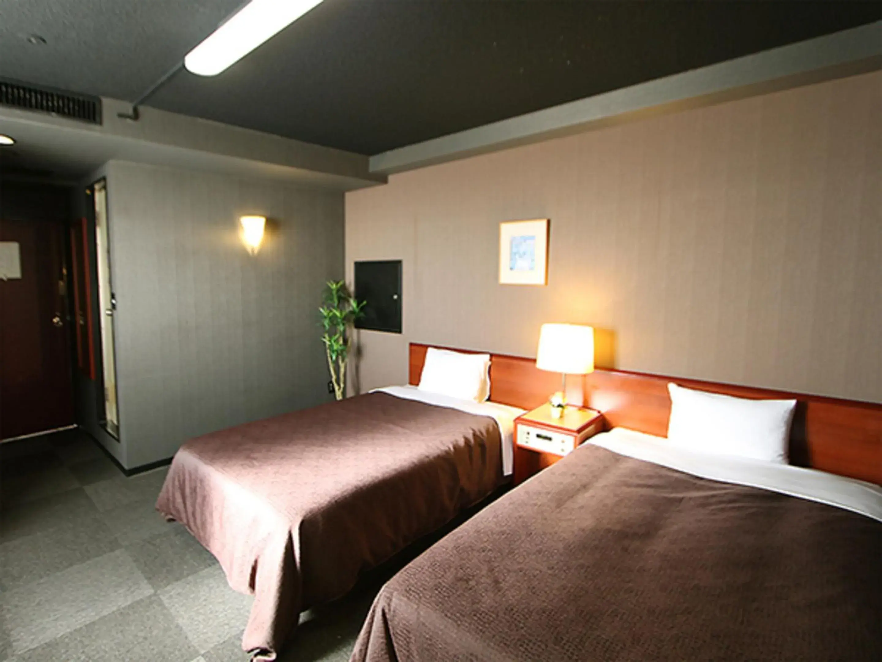 Bed in HOTEL LiVEMAX BUDGET Yokohama Tsurumi