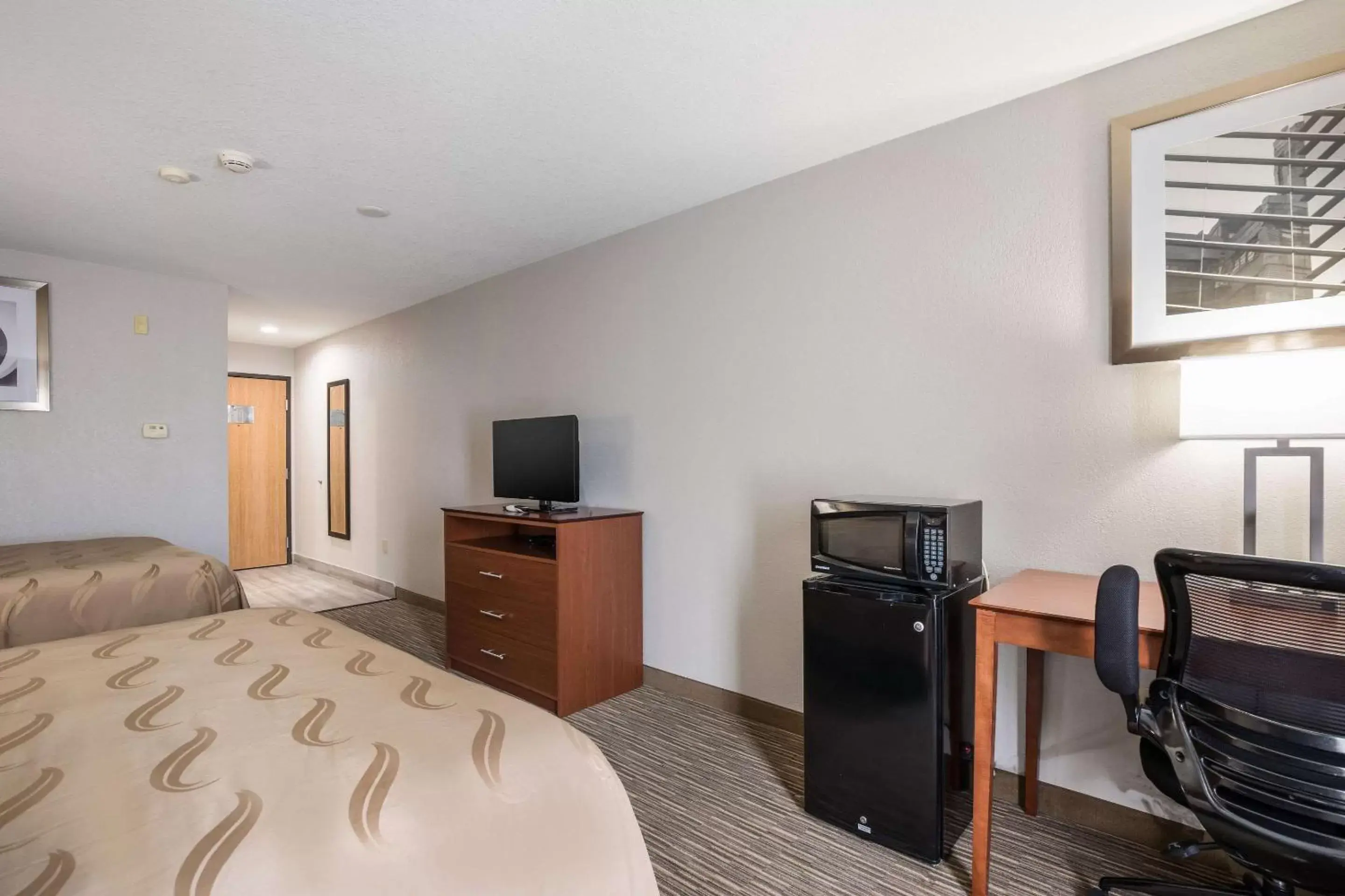 Photo of the whole room, TV/Entertainment Center in Quality Inn & Suites