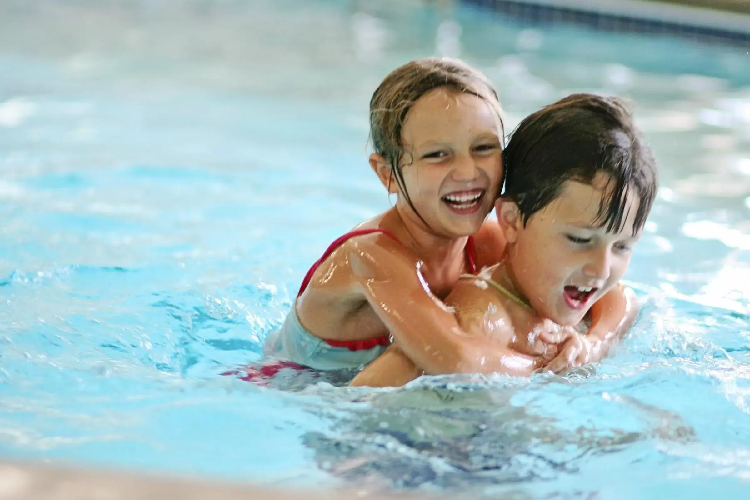 young children, Swimming Pool in AmericInn by Wyndham Newton