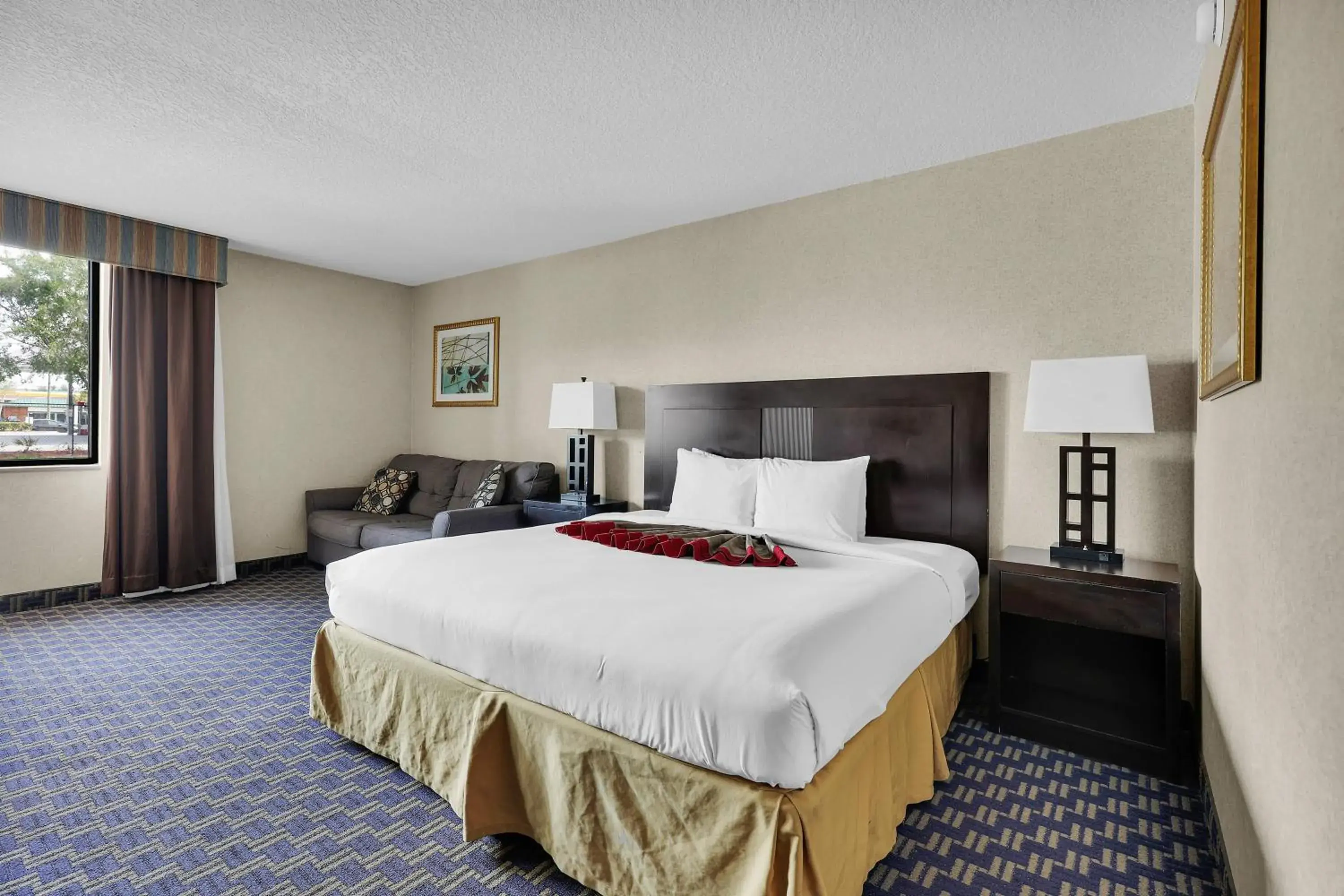Bed in Ramada by Wyndham Jacksonville I-95 by Butler Blvd