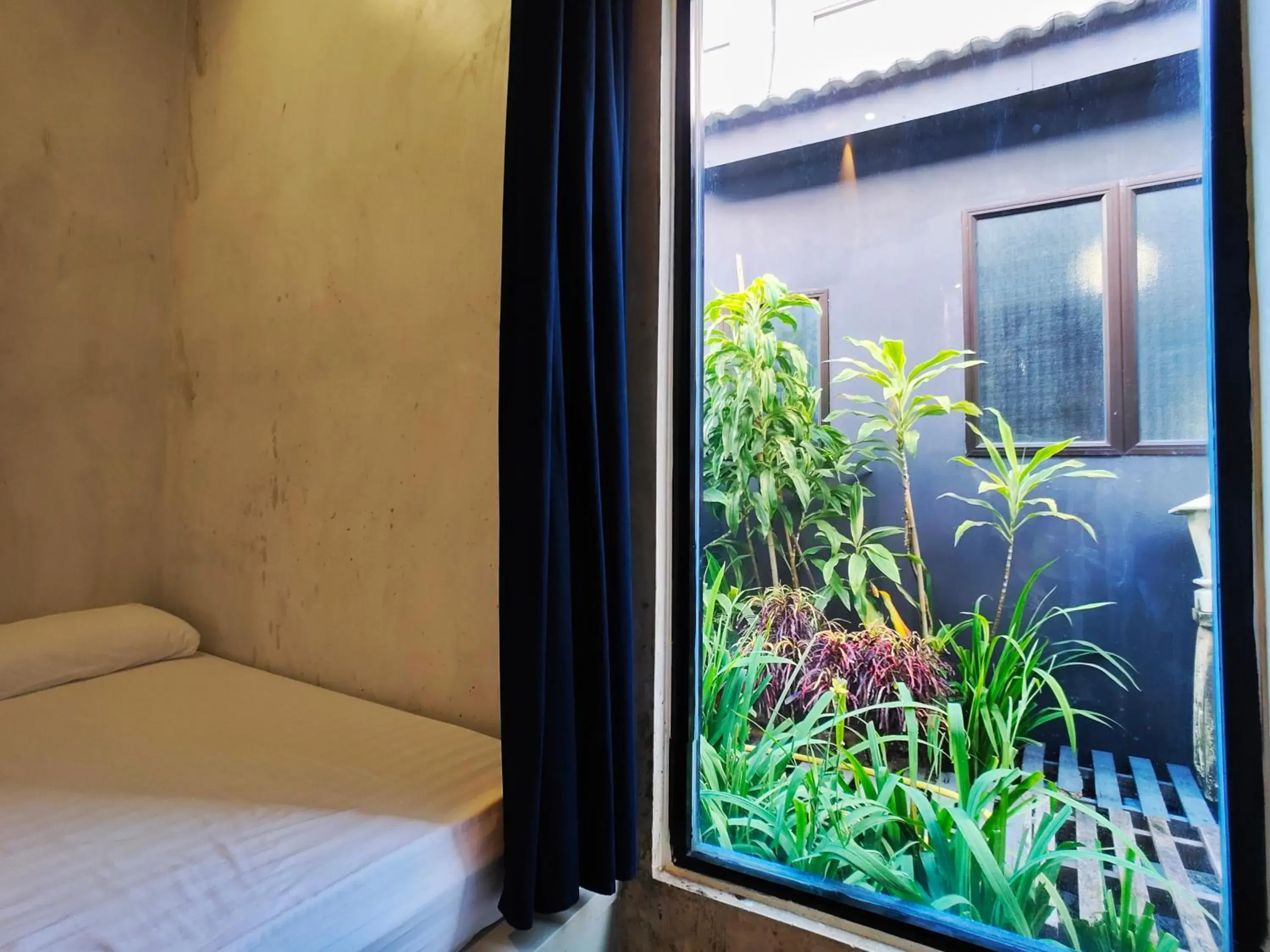 Bedroom in Beds In Garden Hostel