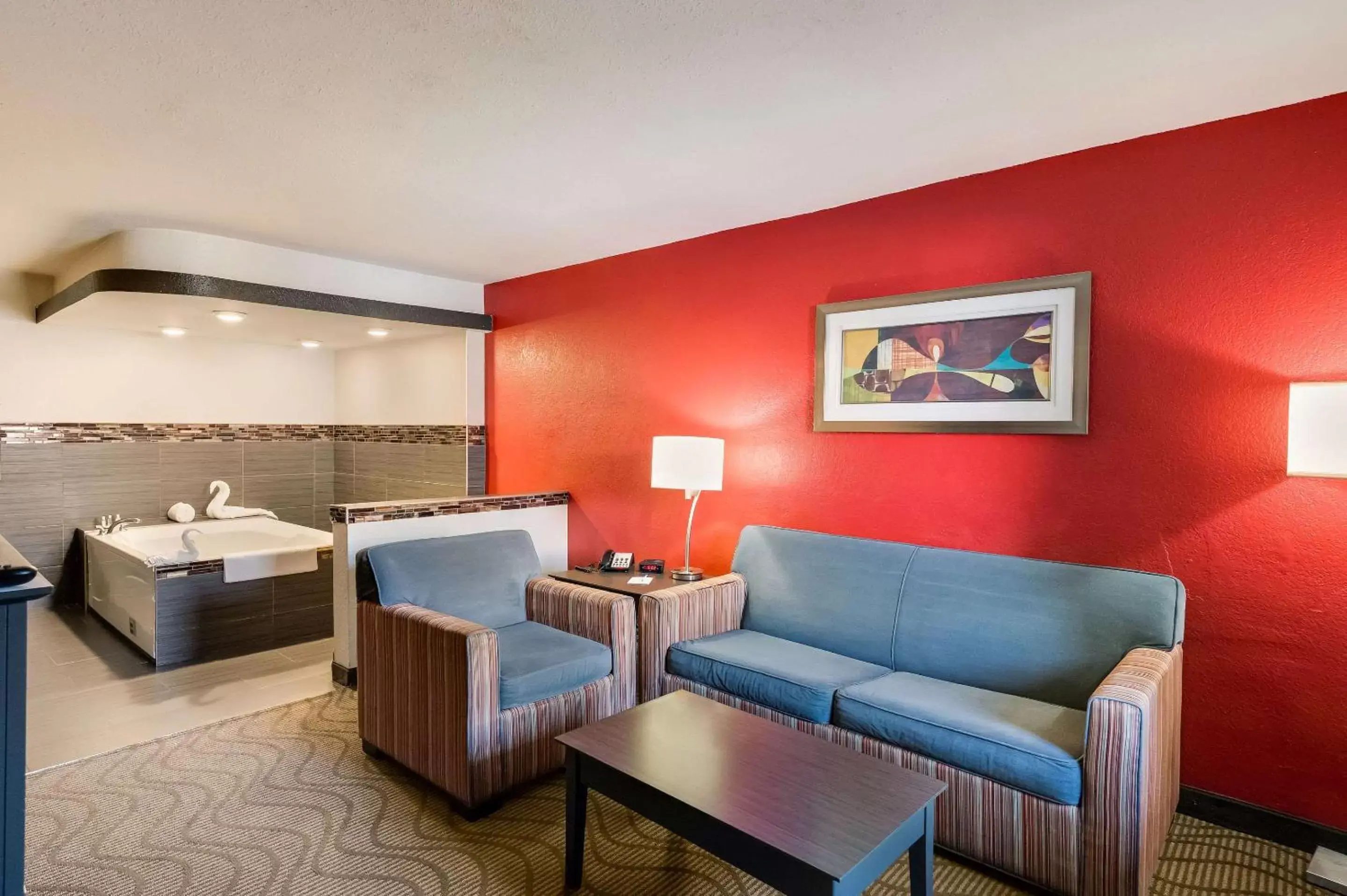 Bedroom, Seating Area in Clarion Inn & Suites Russellville I-40