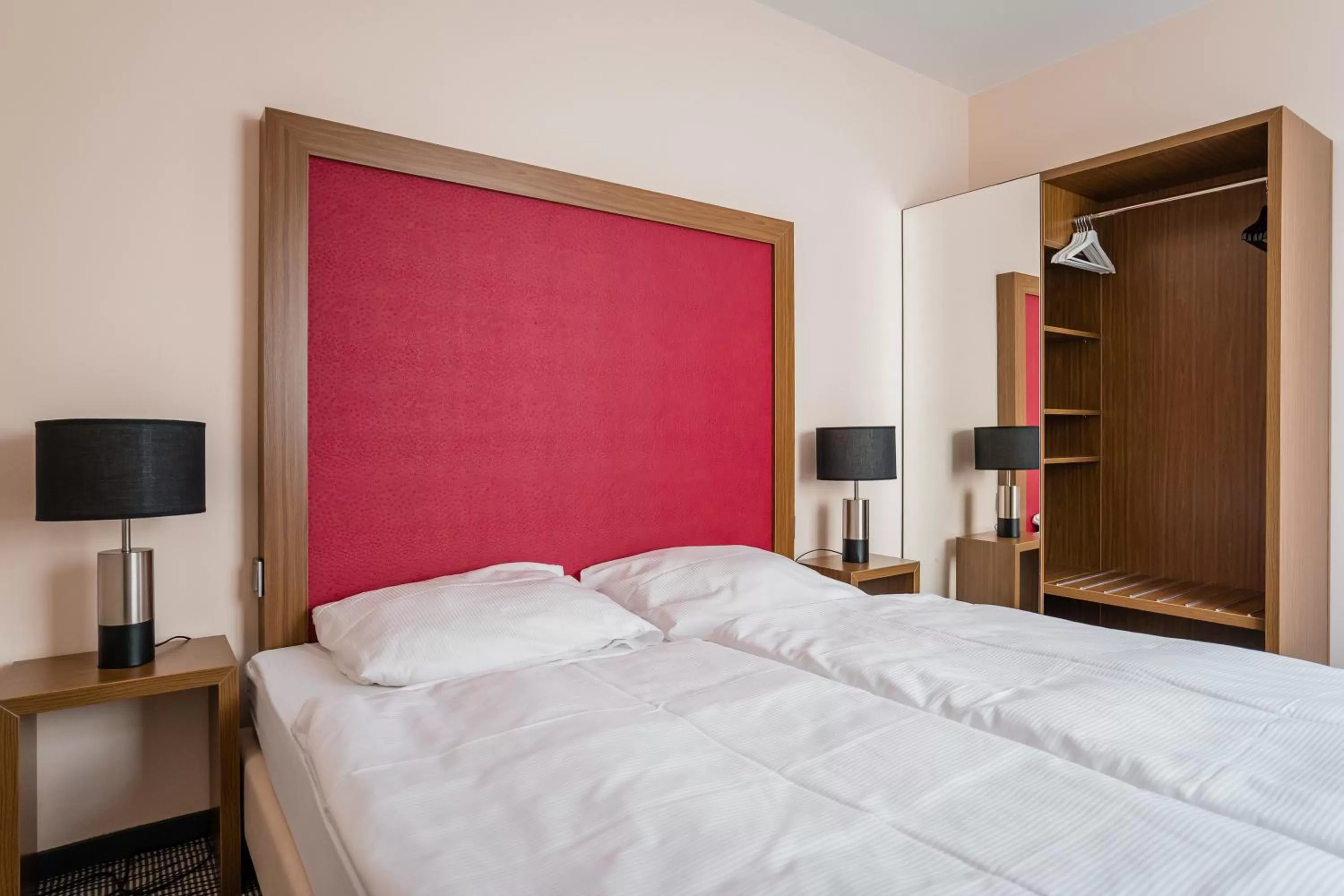 Bed in Point Hotel Apartments and Rooms