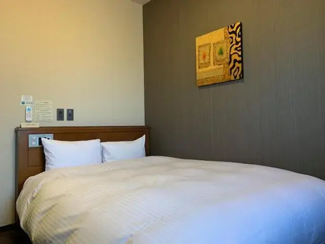 Bed in Hotel Route-Inn Sendaiko Kita Inter