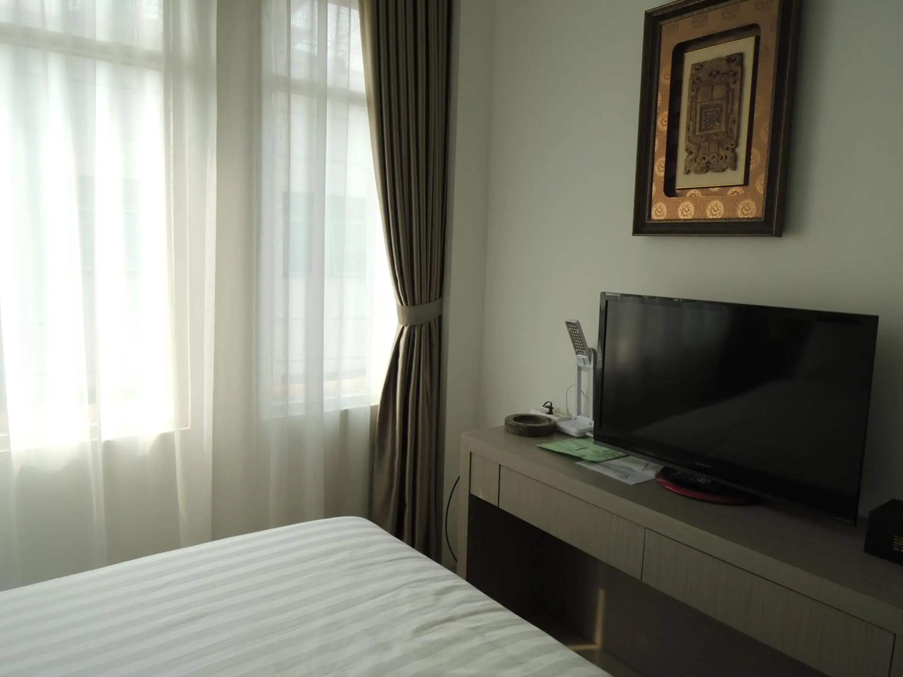 TV and multimedia, TV/Entertainment Center in Hotel 55