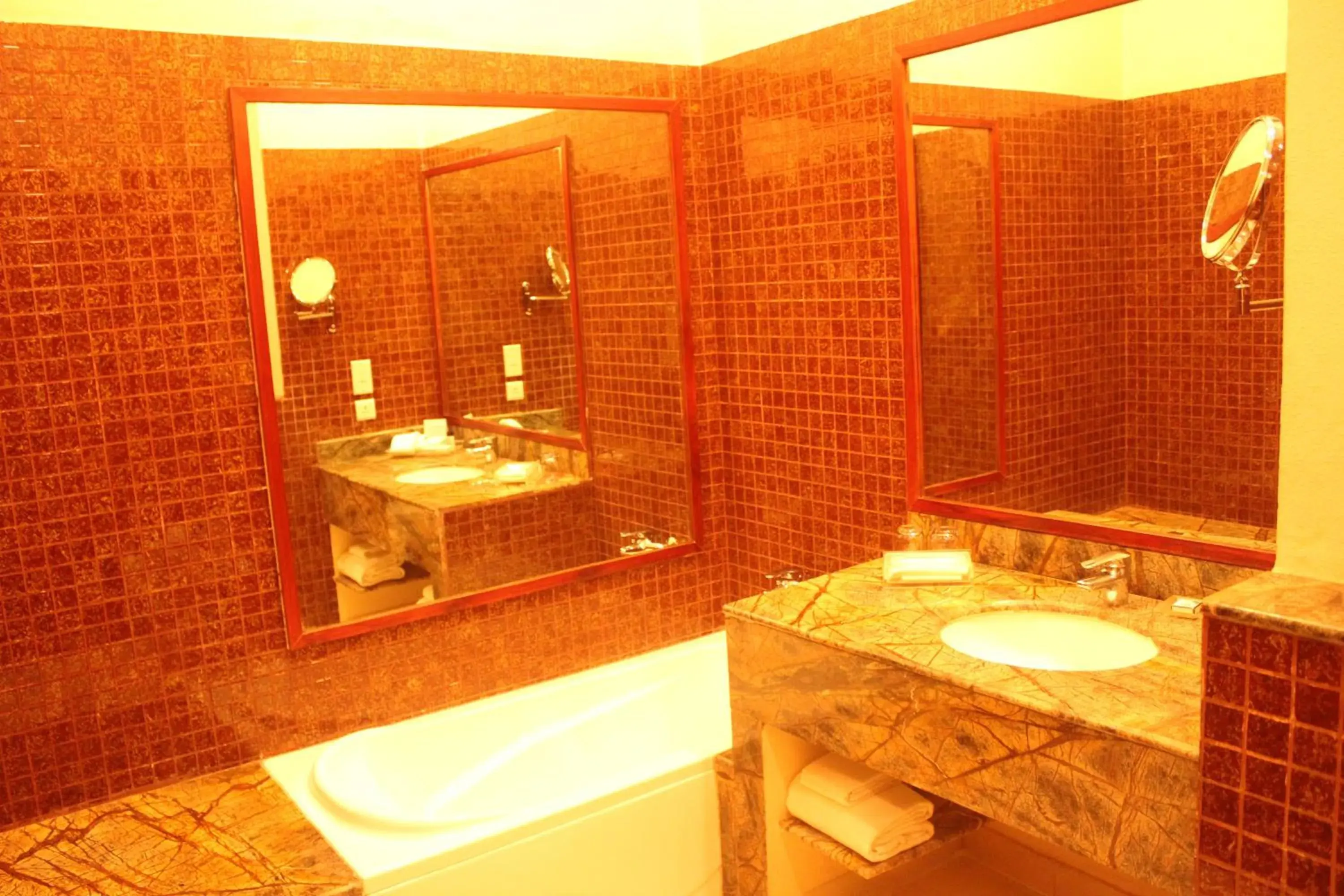 Bathroom in Ramada by Wyndham Jaipur Jaisinghpura