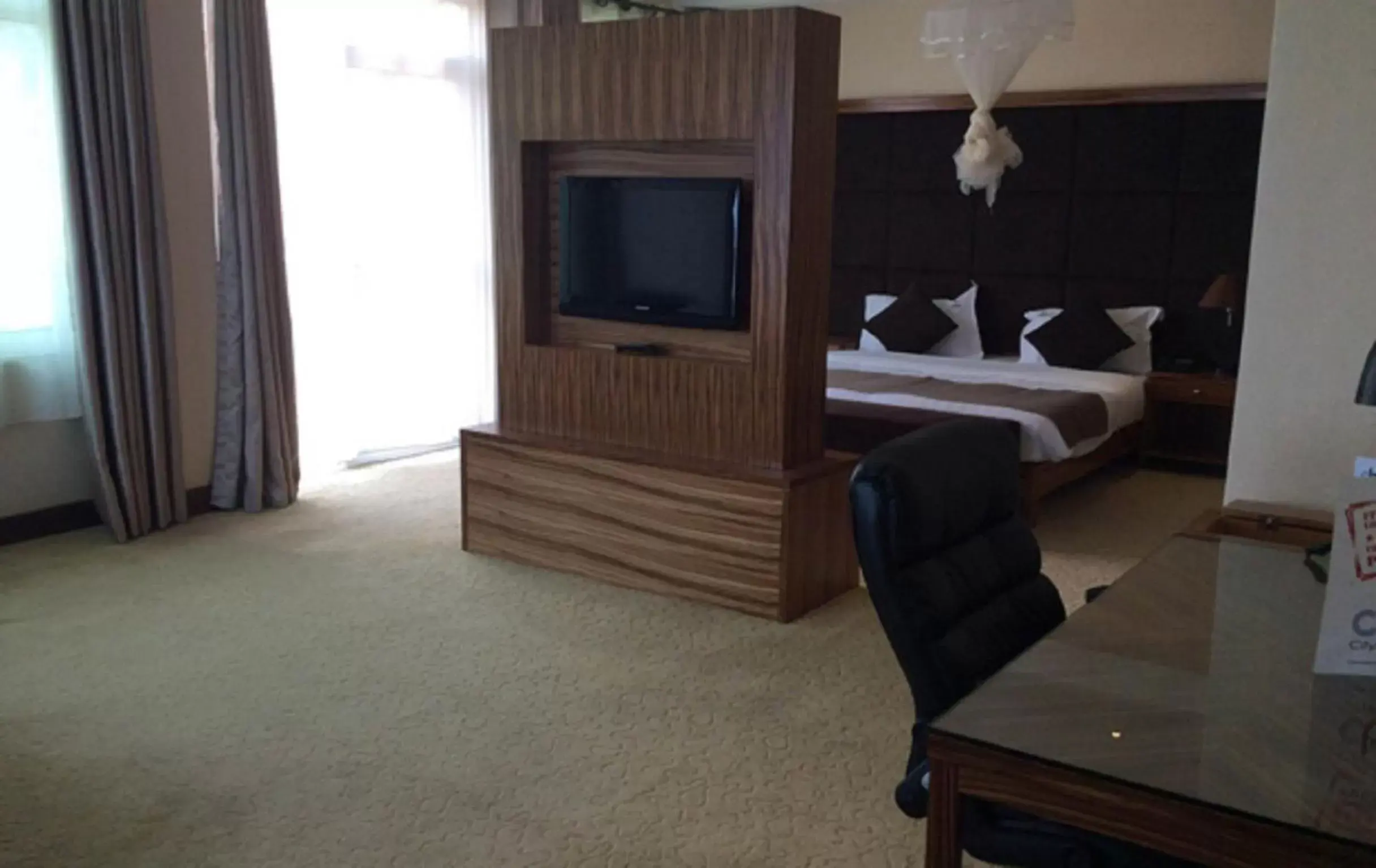 Photo of the whole room, TV/Entertainment Center in Urban by CityBlue Kigali