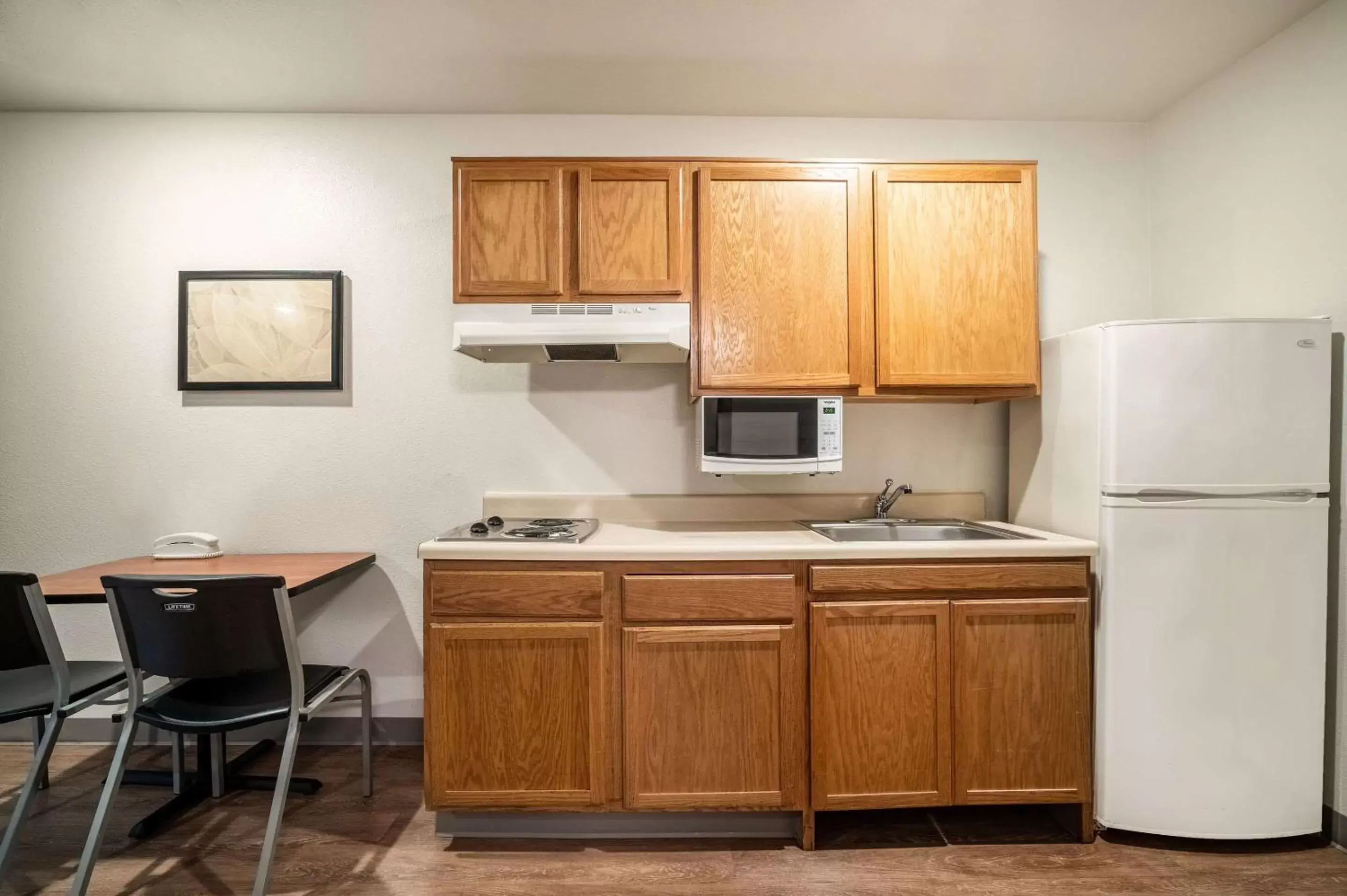 Photo of the whole room, Kitchen/Kitchenette in WoodSpring Suites Corpus Christi