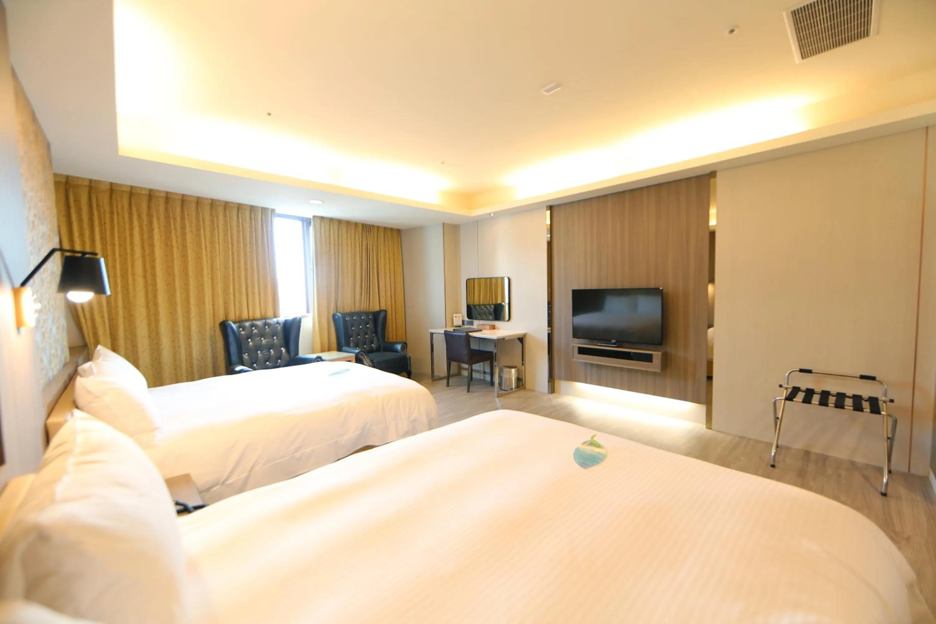 Bed in Grand Earl Hotel